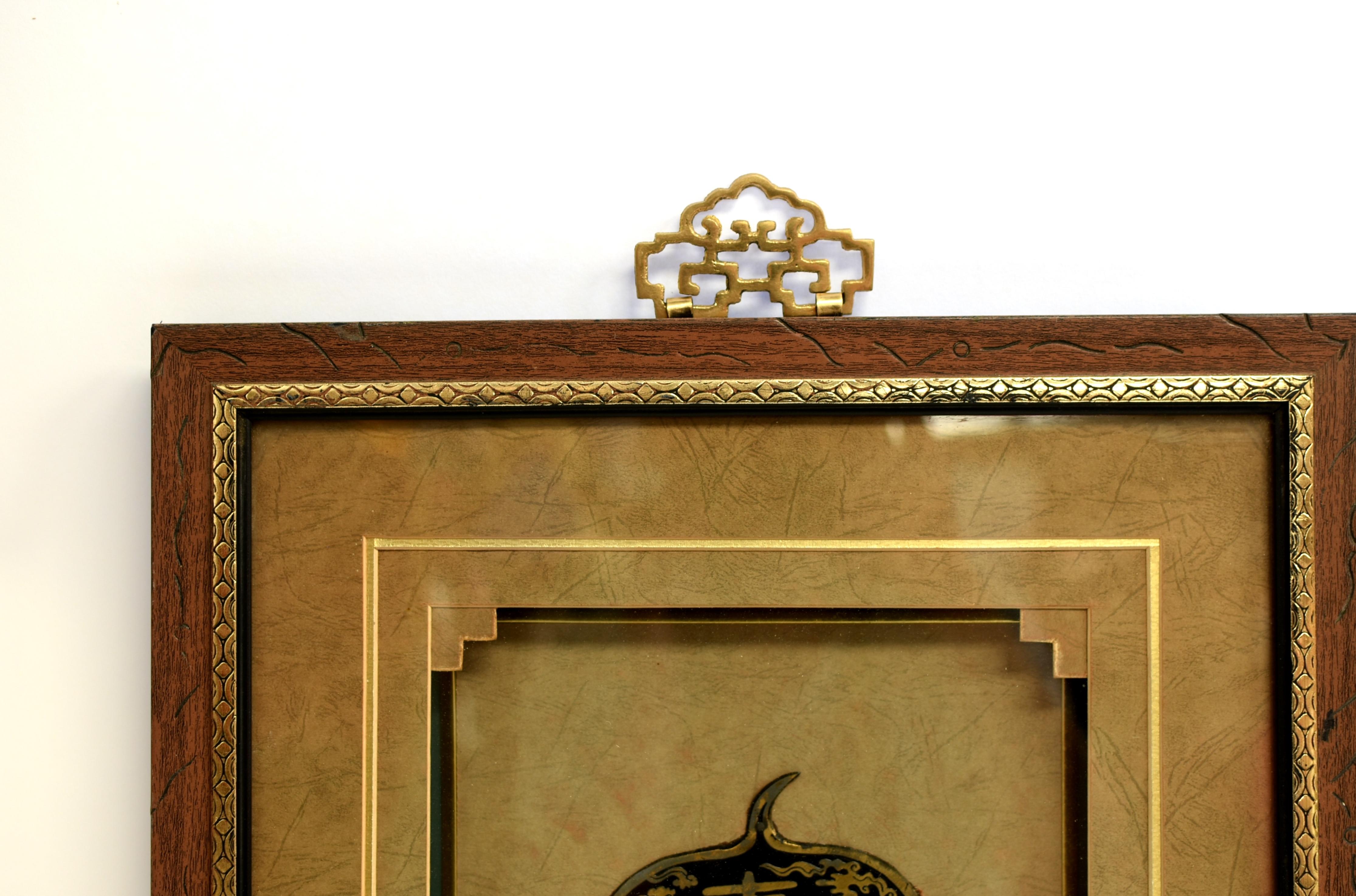 A beautiful vintage shadowbox of solid brass hardware. The exceptionally large gourd-shaped door plate is prominently featured, displaying great details of a finely engraved longevity theme. Anchoring the art is the God of Longevity holding a gourd