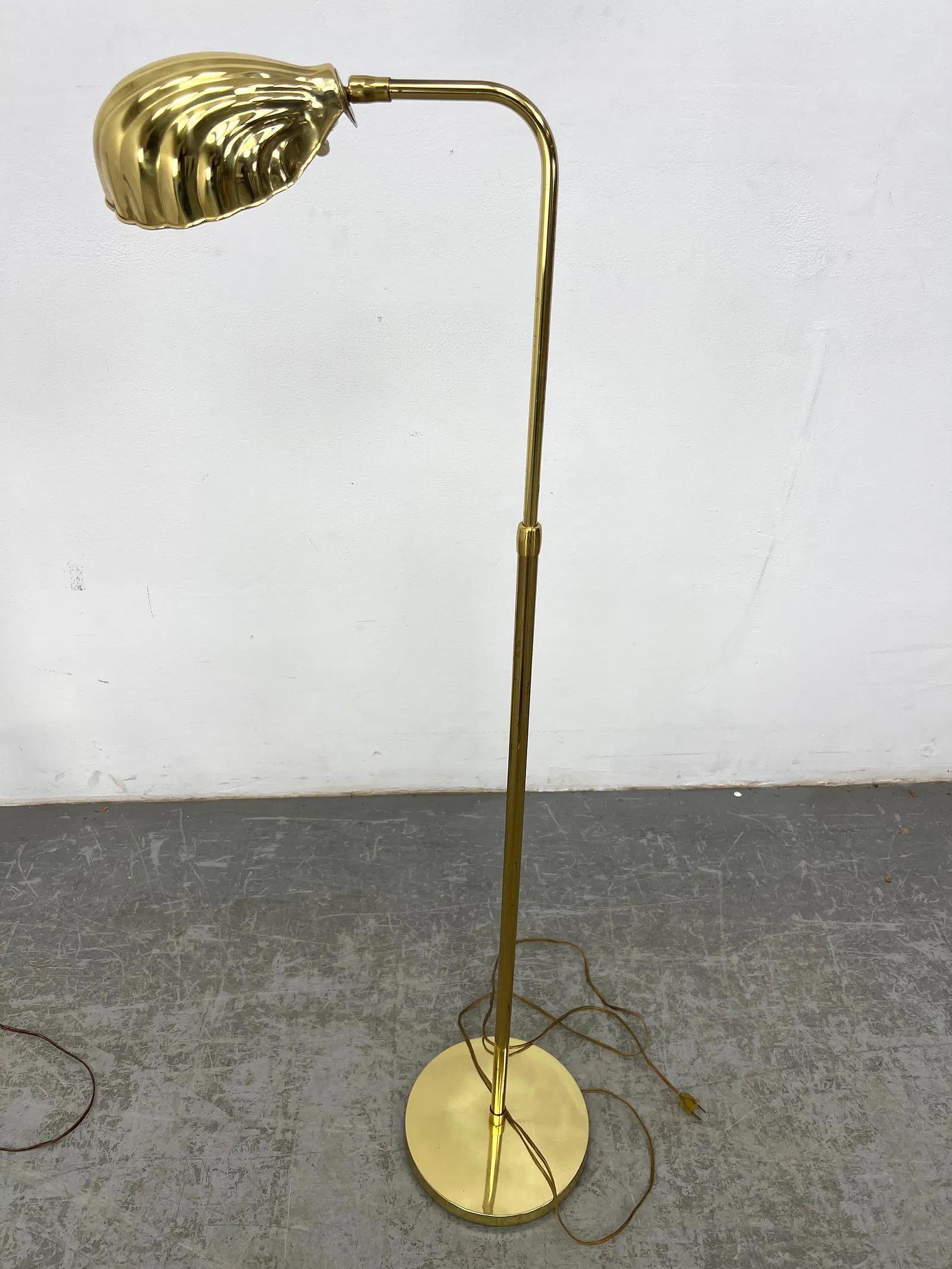 Vintage brass shell shade floor lamp with base diameter of 10 inches. Extends up to 48 inches in height.