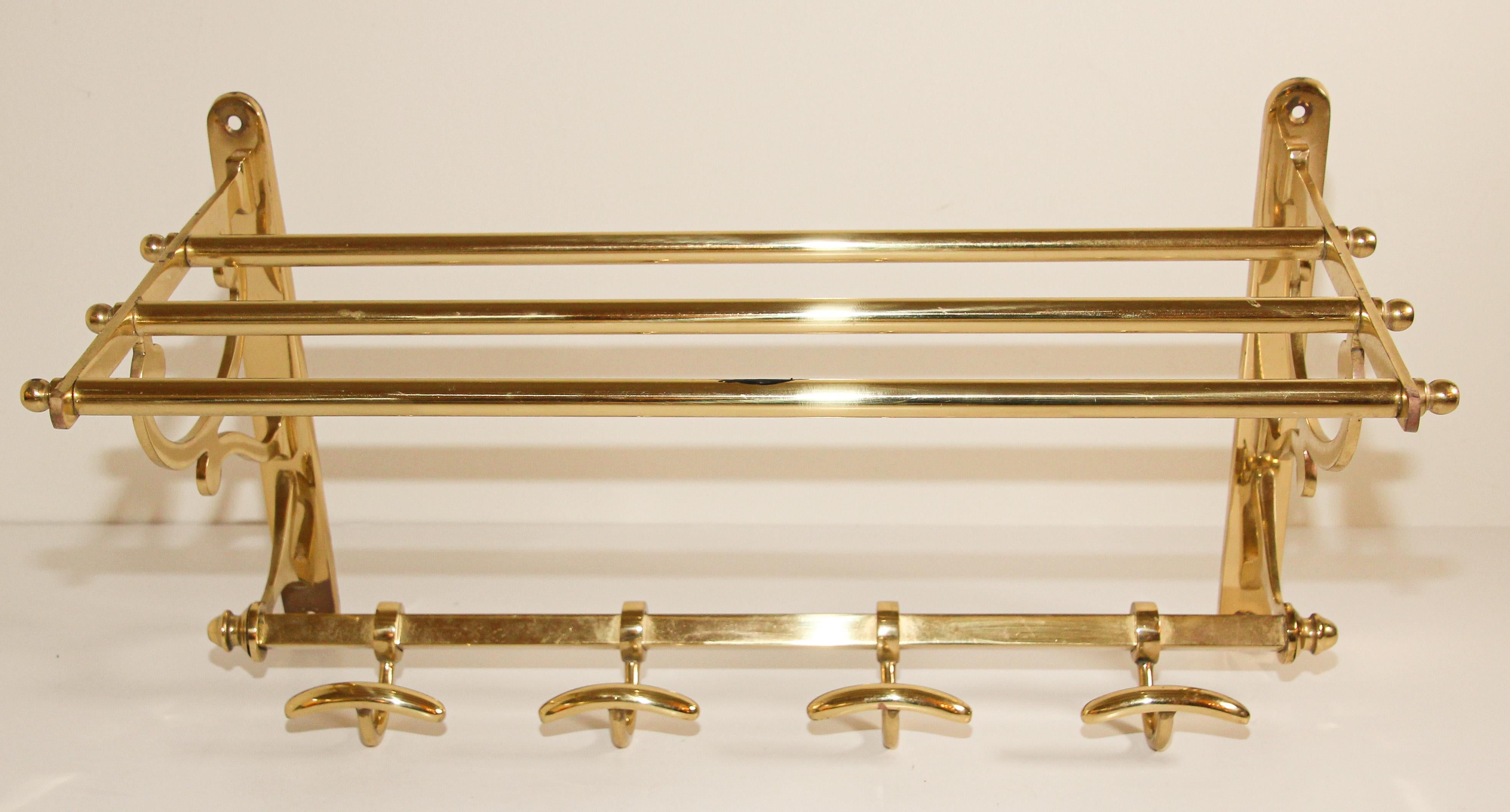 Brass coat rack with shelf and four hooks
Vintage brass coat rack, 1960s
Stunning and exceptional modernist coat rack or wall wardrobe. 
This great piece is functional and highly collectable, it would perfectly fit in any design interior.
A