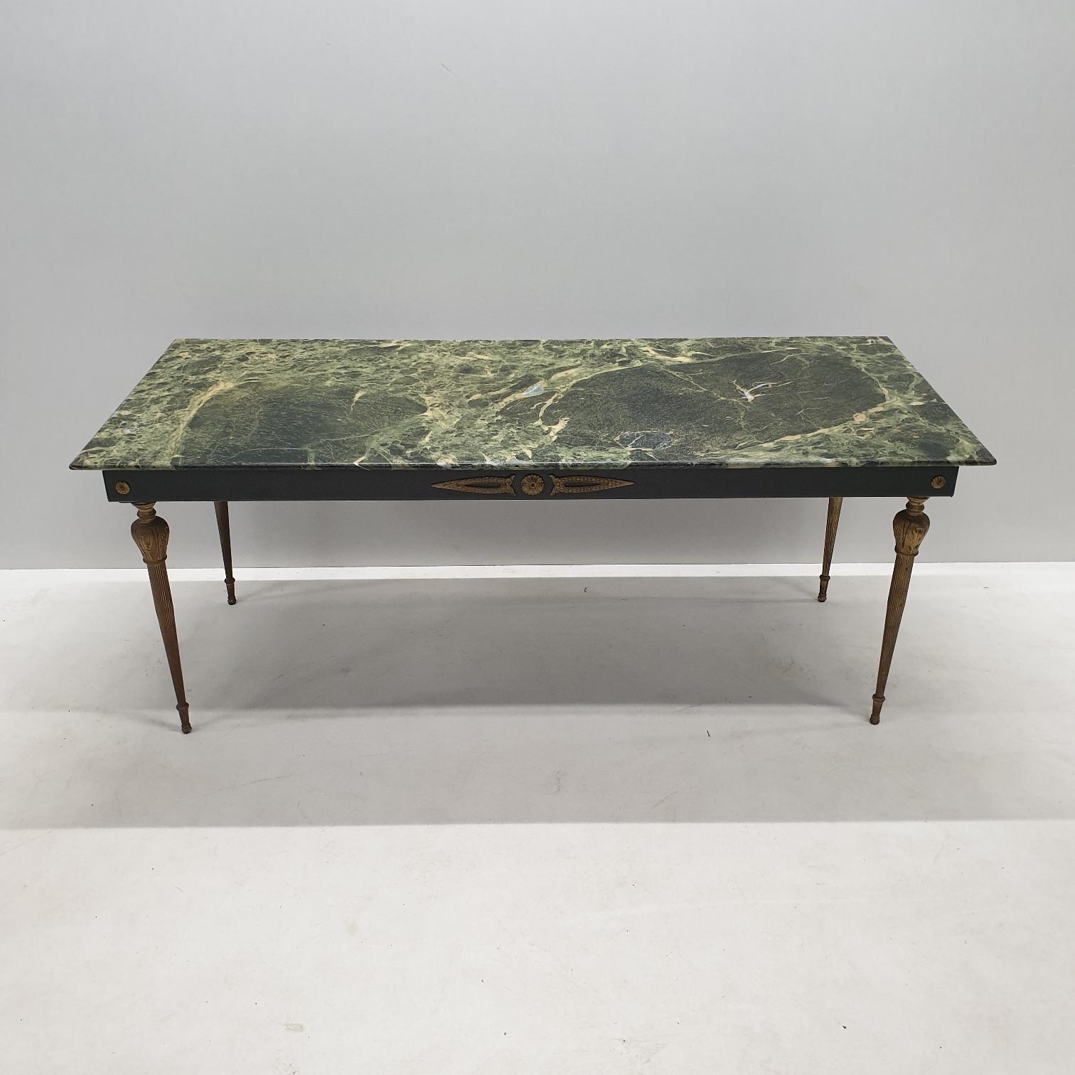 Vintage brass coffee table with a heavy loose green marble top, 1950s.
In the style of Maison Baguès.

 