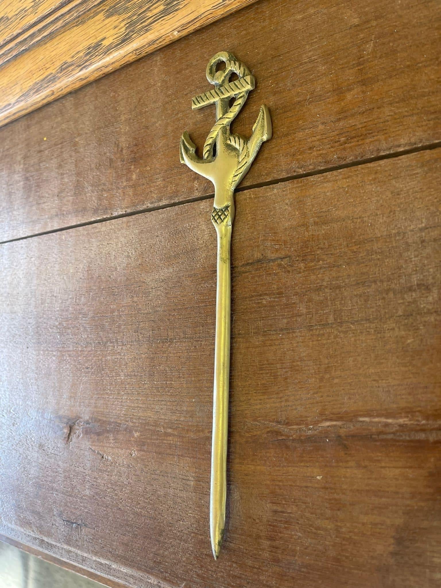 Letter Opener with Anchor and Rope Details at the Top. Vintage Condition Consistent with Age as Pictured.

Dimensions. 9 W ; 2 D ; 1/4 H