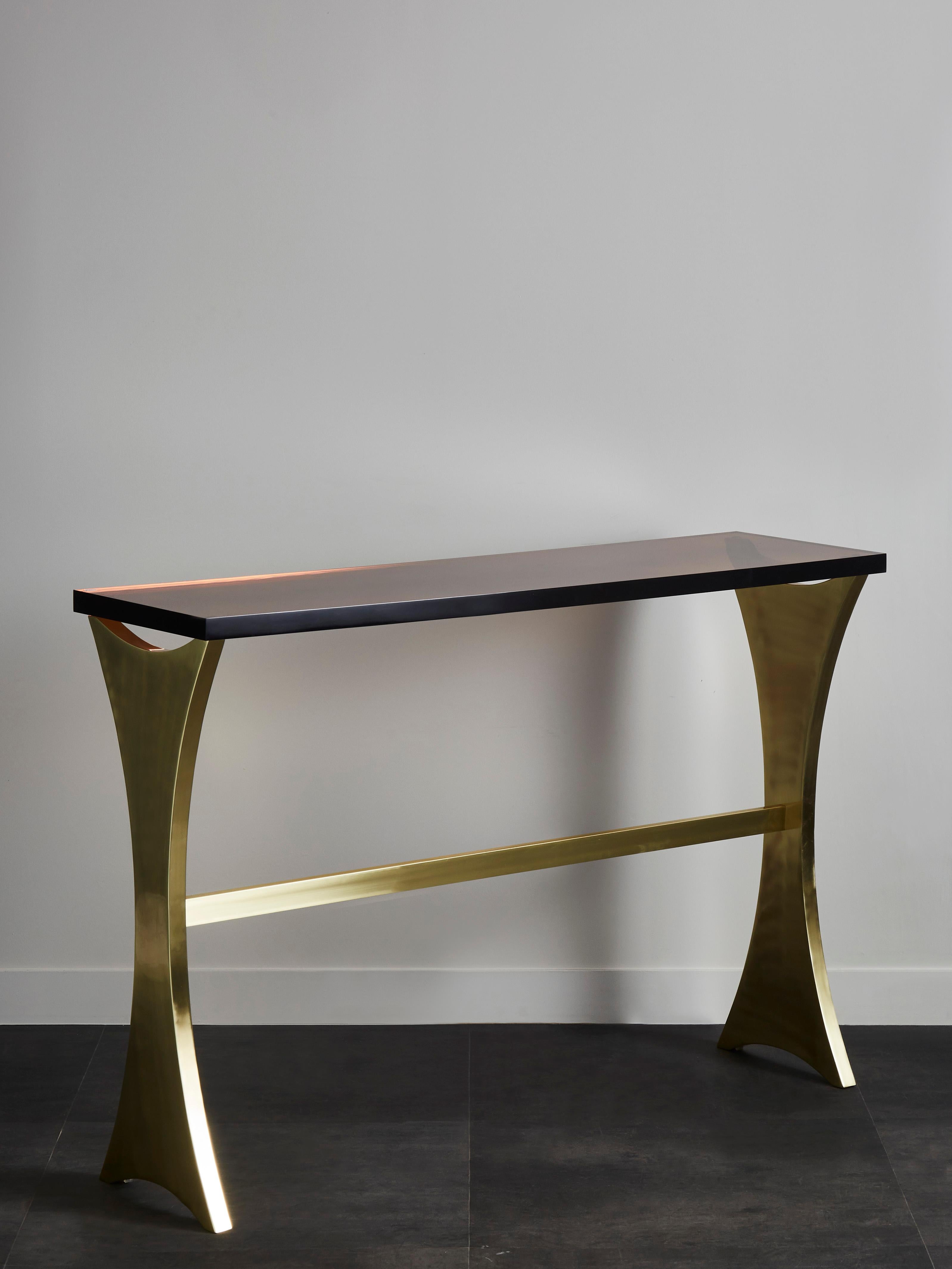 Vintage brass console with smoked resin top.
Italy, 1970s.