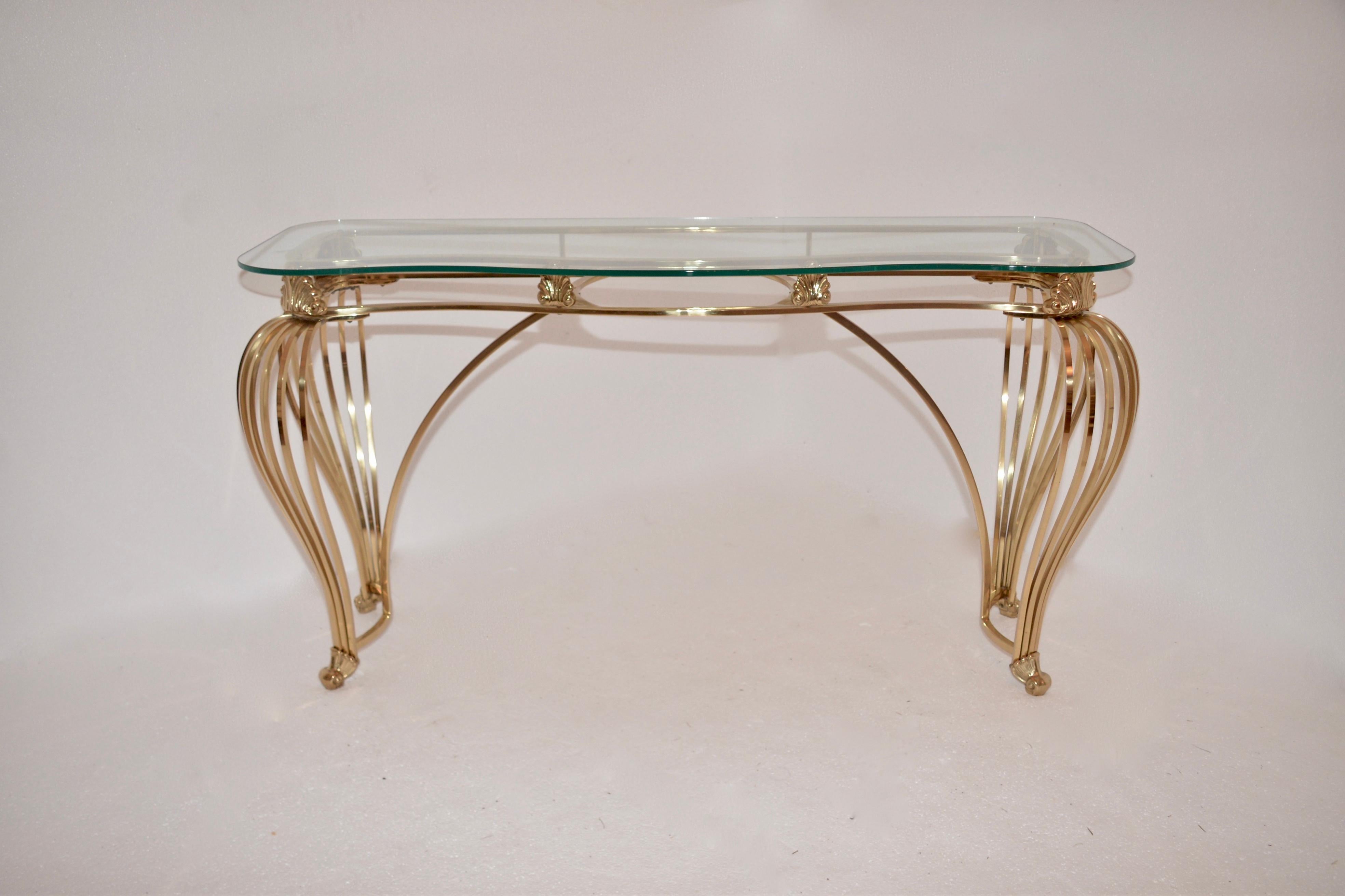 Vintage solid brass console table with scrolled legs and a tempered glass top.
