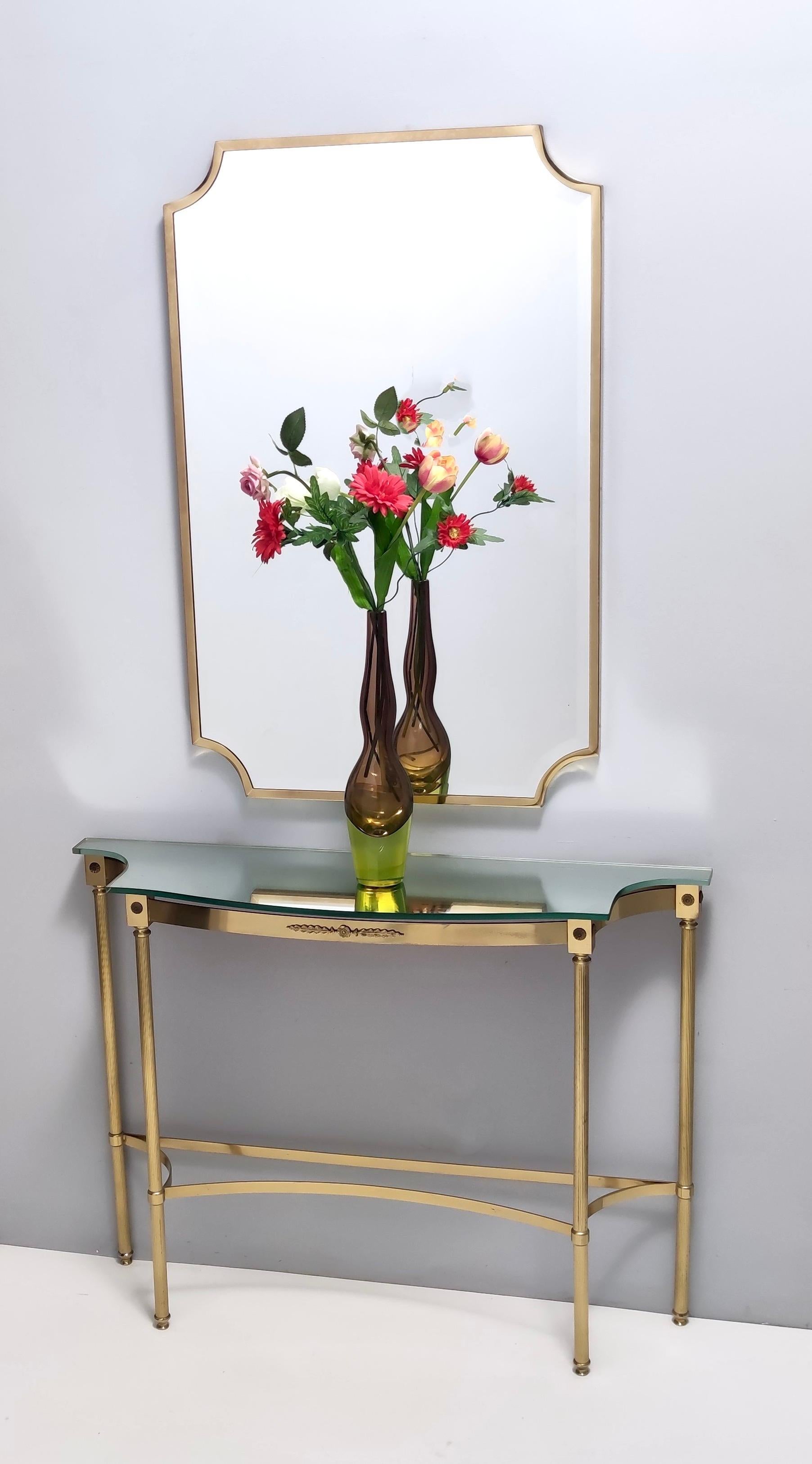 Made in Italy, 1960s.
This console table features a mirrored top and a brass frame.
It is a vintage item, therefore it might show slight traces of use, but it can be considered as in very good original condition and ready to become a piece in a