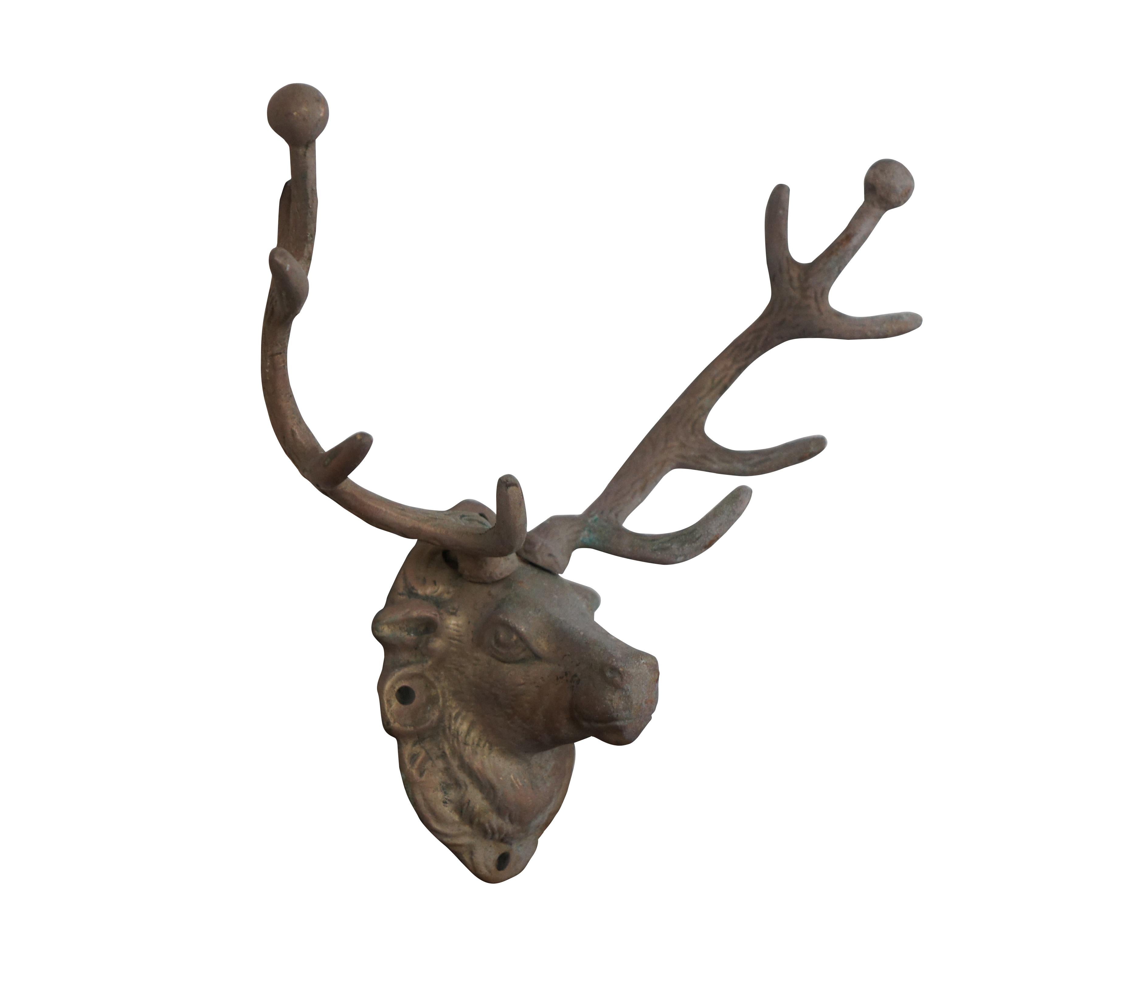 Vintage large cast brass hunt theme hat / coat hook or key rack in the shape of a mounted deer / elk / stag / reindeer with ten point antlers.

Dimensions:
9.5