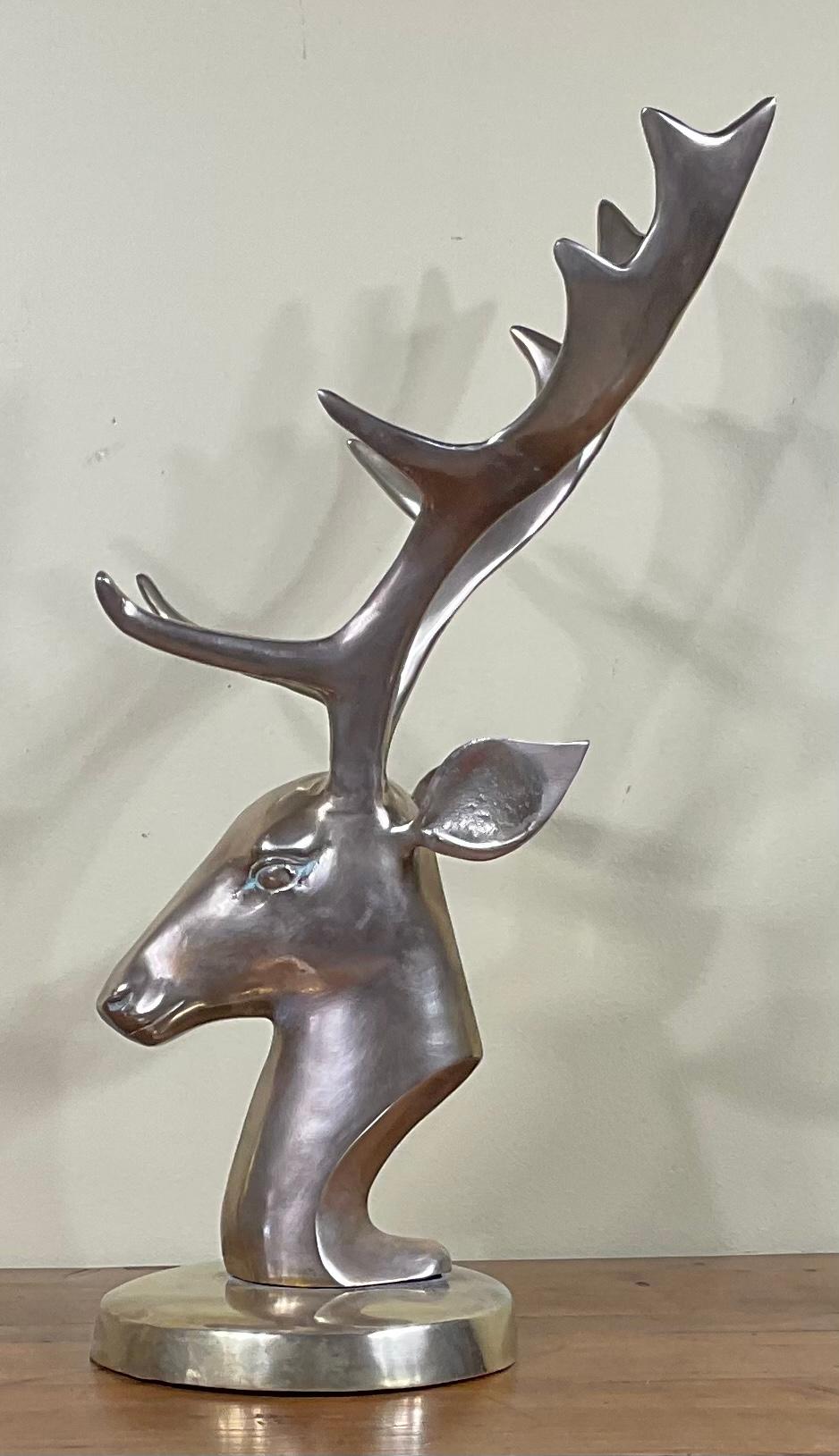 Elegant mid century deer head made of solid brass, professionally mounted on a beautiful brass made. Great decorative object of art for display.
    