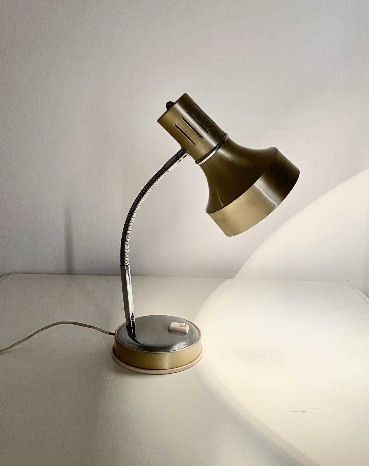 Vintage brass desk lamp in industrial style. Flexible structure. Chromed flexible pole and base. Perfectly working and in really good conditions. 

Please visit our profile page to check our constantly updated 200+ original vintage collection (and