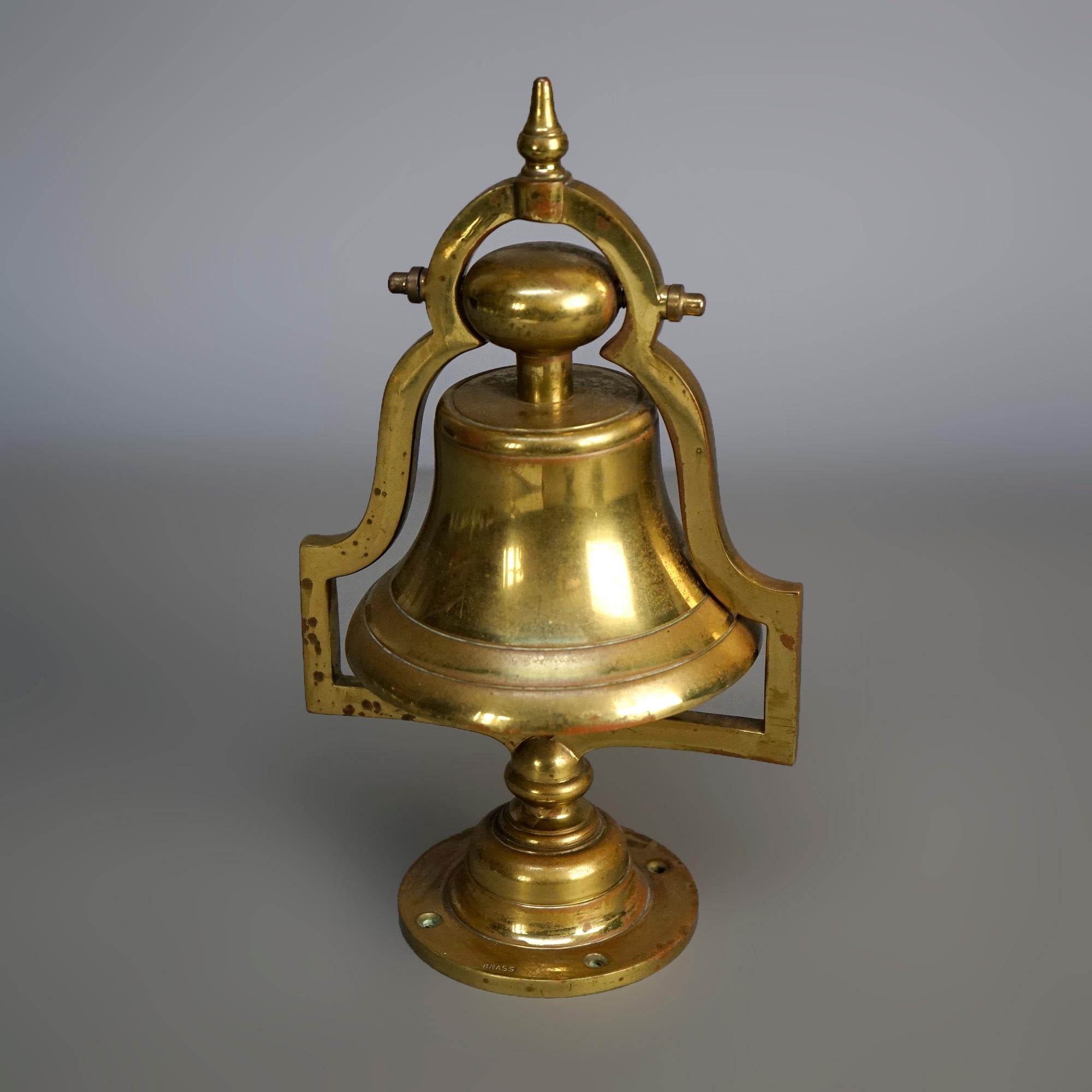 A desk top railroad bell offers cast brass construction with shaped frame over flared base, 20th century.

Measures- 12.5''H x 7''W x 5.5''D.