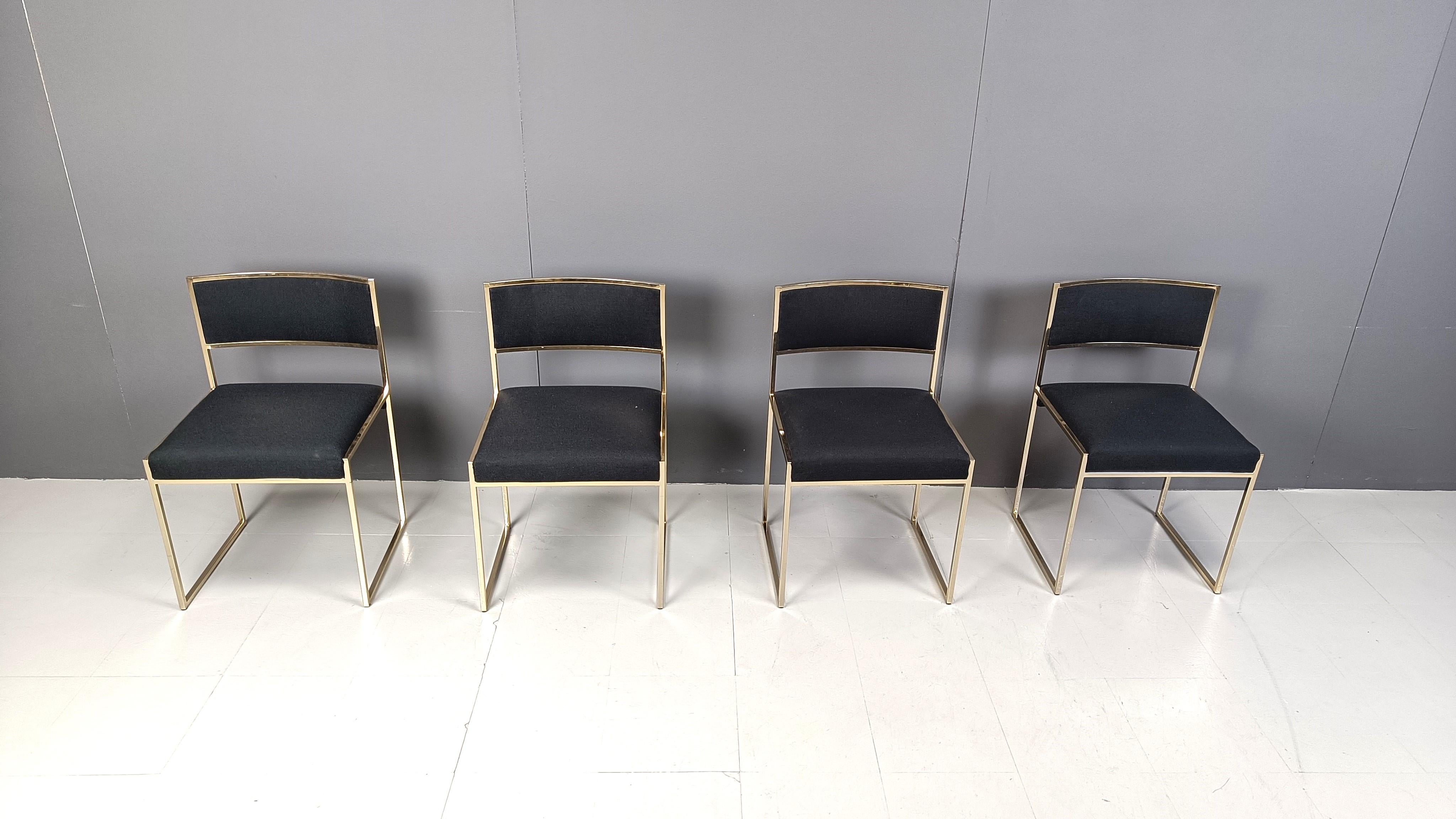 Set of 4 dining chairs designed by Willy Rizzo featuring patinated brass frames and new black fabric upholstery.

1970s - Italy

Timeless design with a touch of seventies glam.

Dimensions:
Height: 78cm
Width: 50cm
Depth: 40cm
Seat Height: