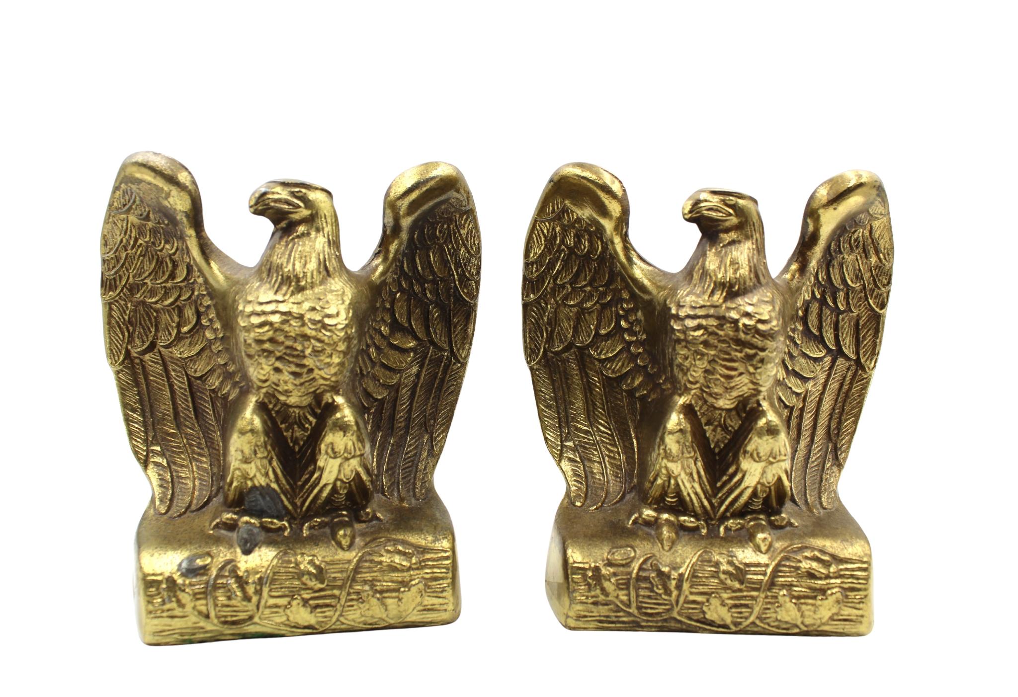 This is an appealing set of vintage brass bookends. The bookends each depict a spread-wing bald eagle perched on a branch. The branch is wrapped in decorative vines.

In 1782, Congress designated the bald eagle, a bird unique to North America, as