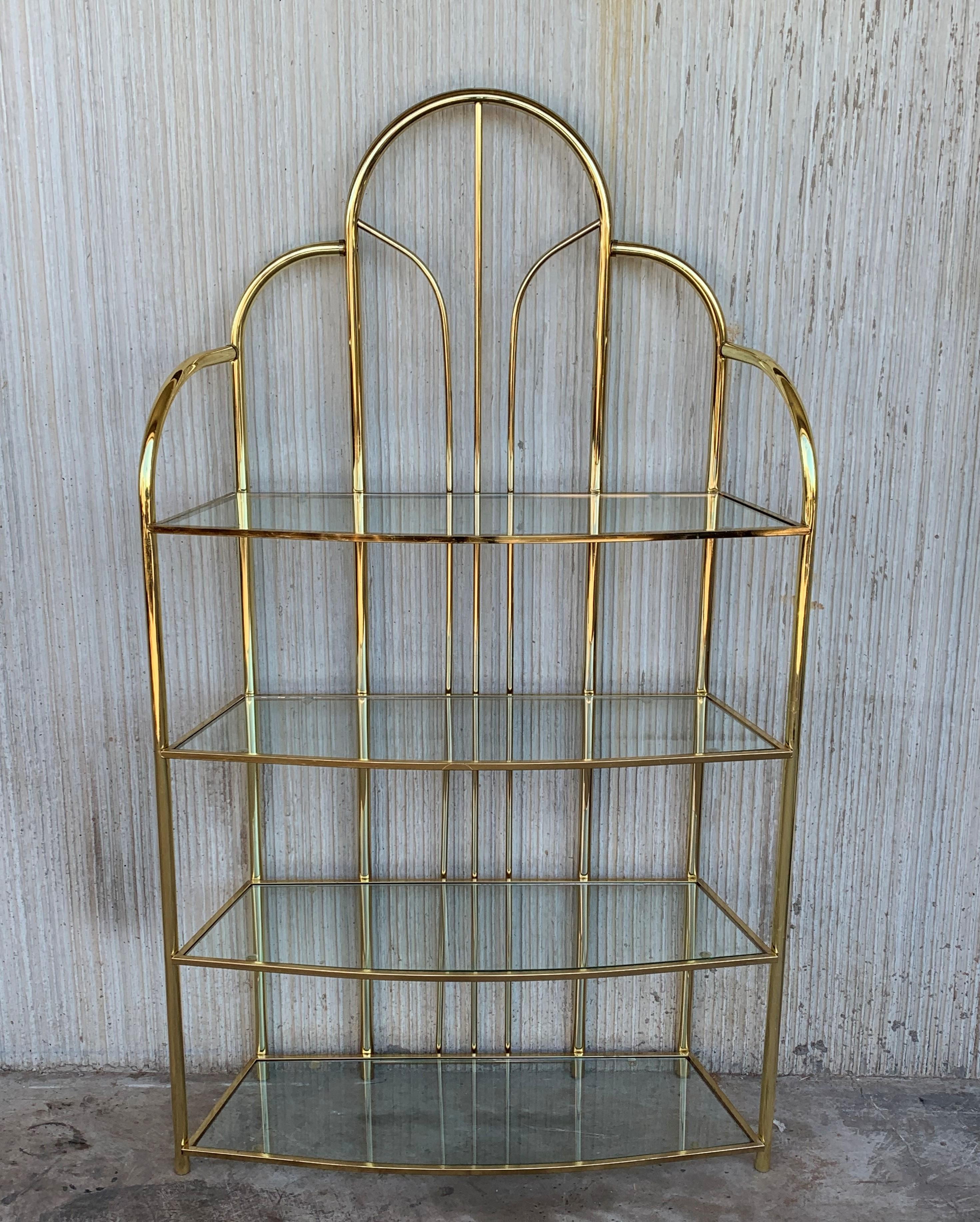Vintage arched brass shelf shelves étagères. Chrome has been polished. Glasses are originals. In the style of Milo Baughman.

Height shelves measurements: 
46in
31.5in
16.52in
2.5in.