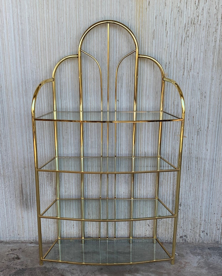 Vintage arched brass shelf shelves étagères. Chrome has been polished. Glasses are originals. In the style of Milo Baughman.

Height shelves measurements: 
46in
31.5in
16.52in
2.5in.