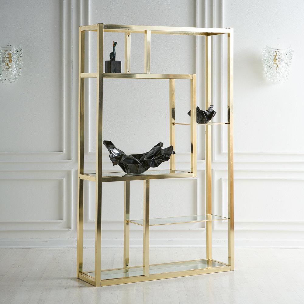 A classic polished brass finish étagère featuring four shelves with varying space for display and storage.

Dimensions: 72