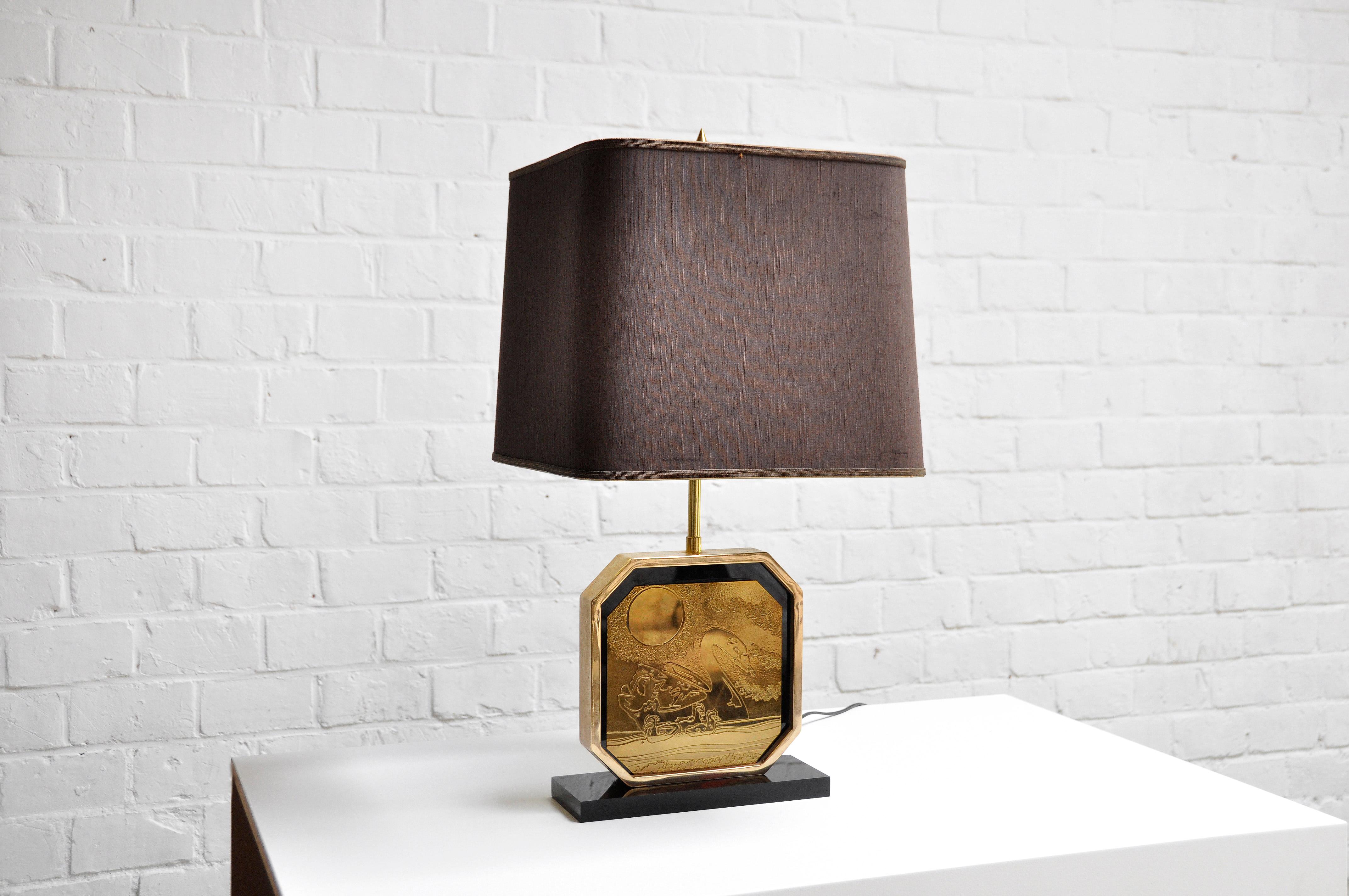 Brutalist table lamp designed by Georges Mathias in the 1970’s. Features a brass frame with a 23 carat handmade etched gold-plated front with a handmade design typical of Mathias' work. The lamp is signed and numbered 123 out of 125. It comes with