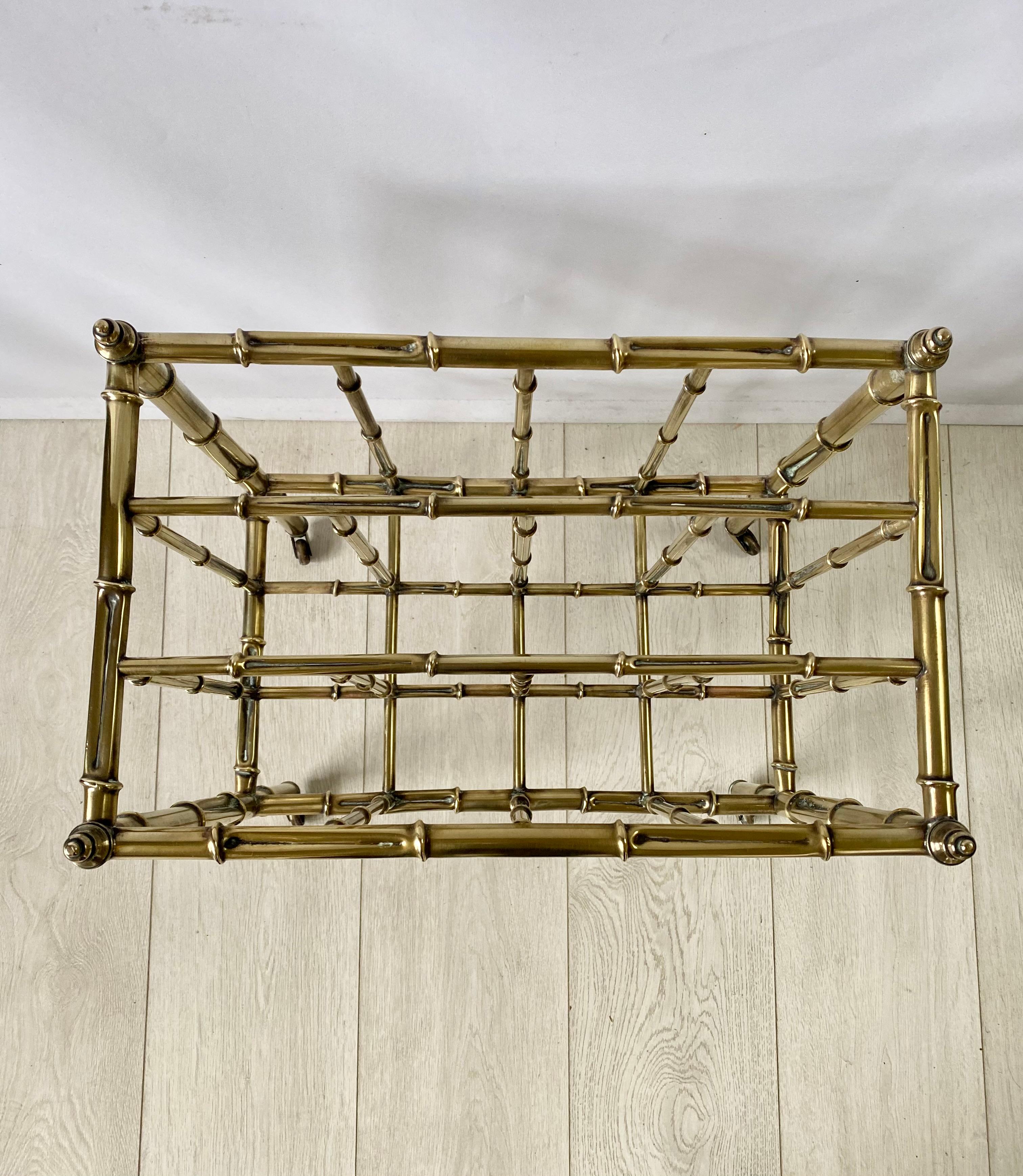 Vintage brass faux bamboo Canterbury or magazine rack

With 3 divisions on castors, 

Polished brass frame

Measures: 45 cm wide, 28 cm deep and 51cm tall.