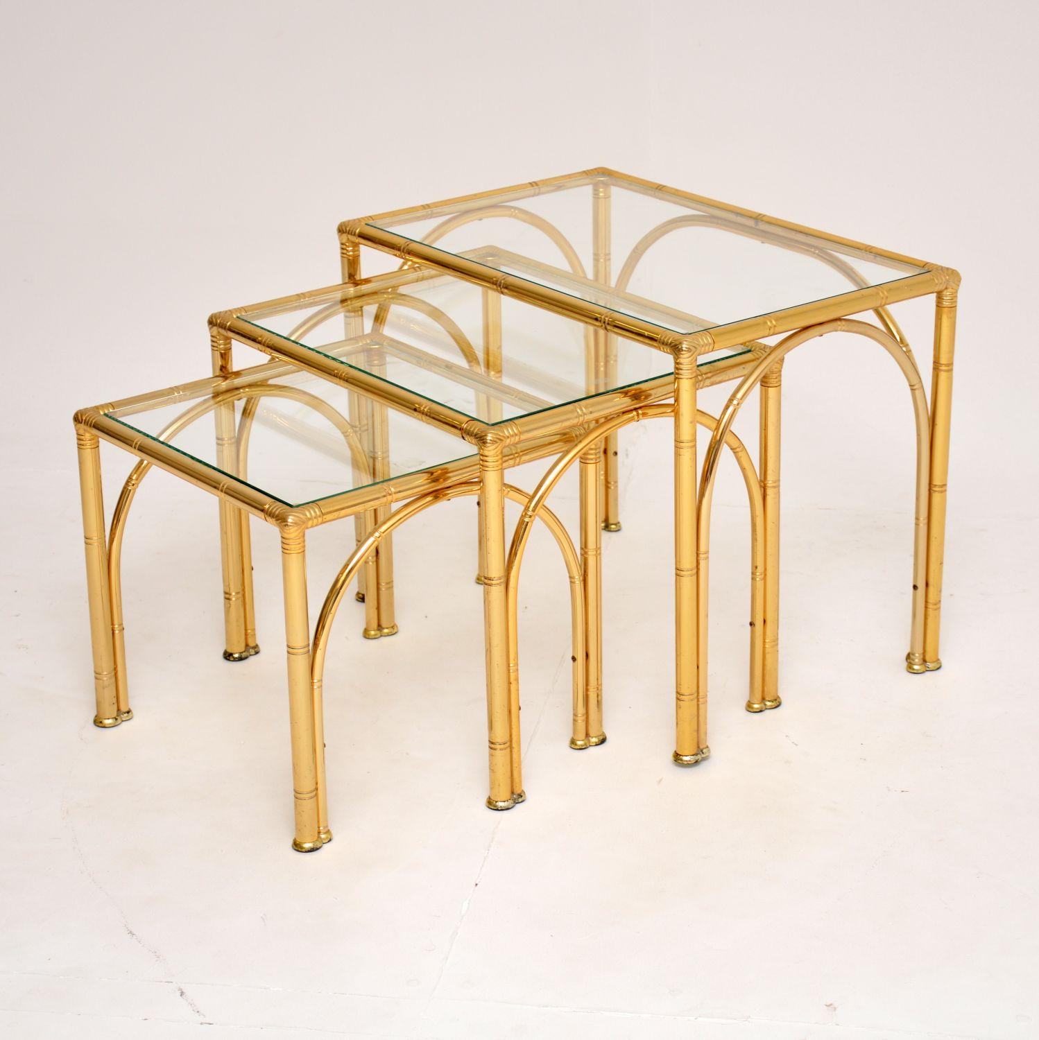 A stunning vintage brass nest of tables in the Hollywood regency style. These were made in England, they date from around the 1970’s.

The quality is excellent, these are beautifully designed and very well made.

The brass frames have only some
