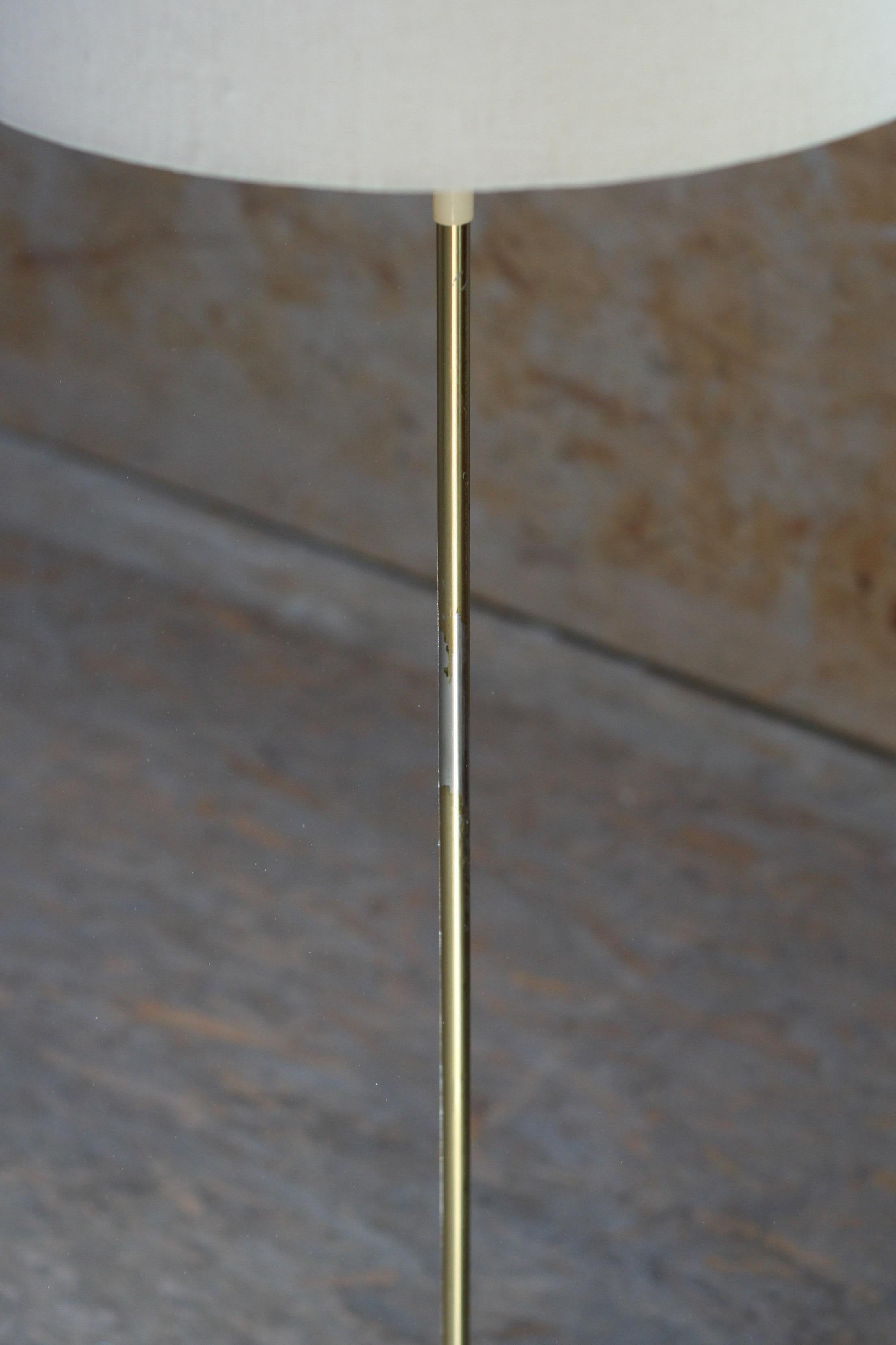 This floor lamp has a very soft light. It consists of taupe colored metal and brass colored iron base, that is really heavy, and of a metal gold plated stick with brass shade base detail.
D(base) 21cm, D(shade) 40cm.