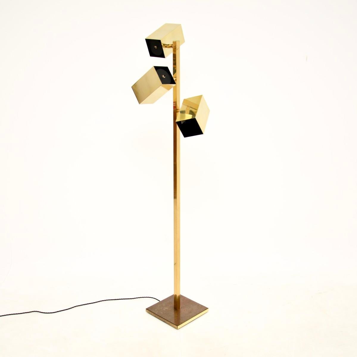 A stunning vintage brass floor lamp by Koch and Lowy. This was made in the USA, it dates from around the 1970’s.

It is of superb quality and has a fantastic design. The three cube shaped shades can swivel, tilt and rotate to aim the light in all