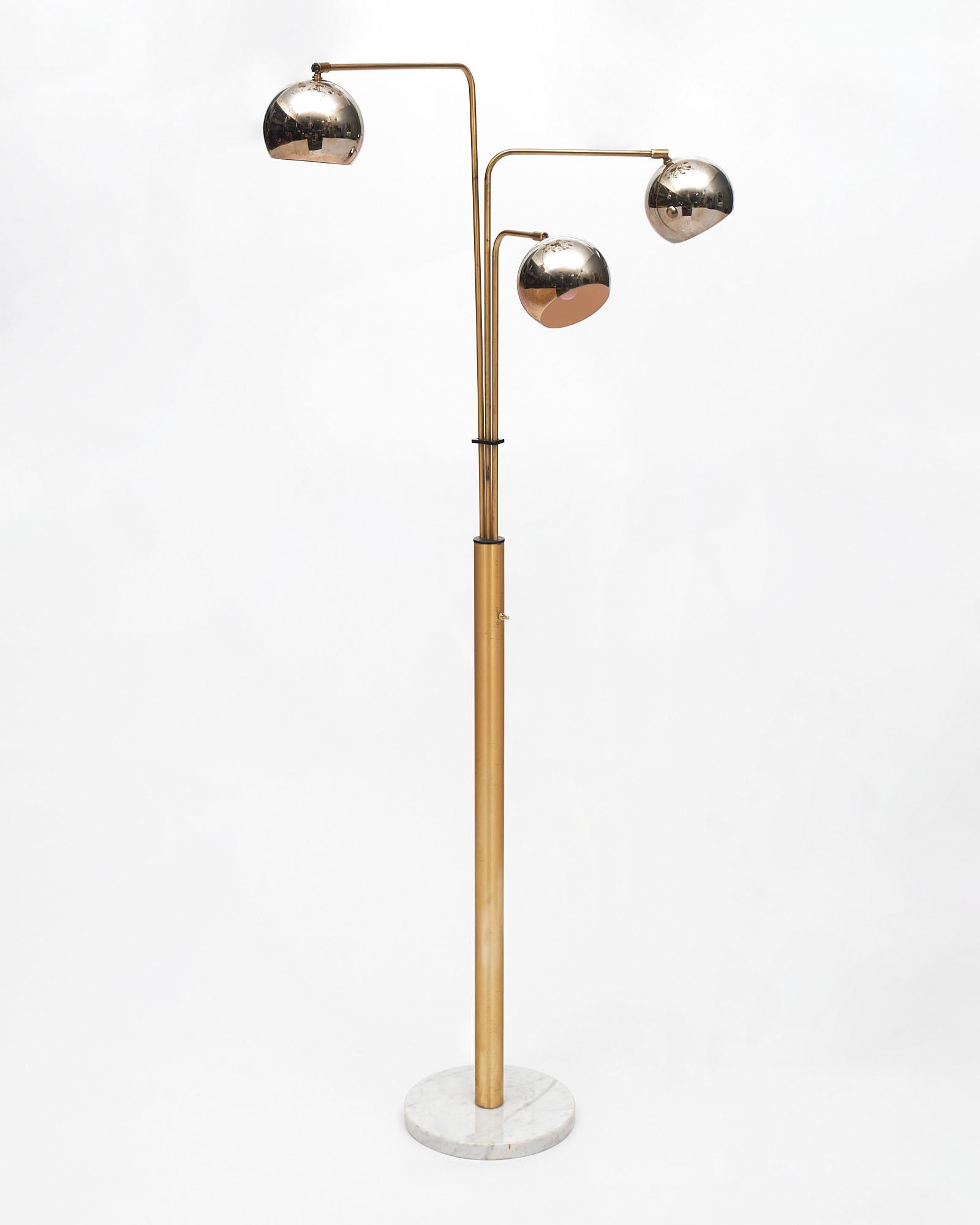 Italian floor lamp by Goffredo Reggiani. Three adjustable spherique chrome lights are articulated from three brass stems that rest on a Carrara marble top base.