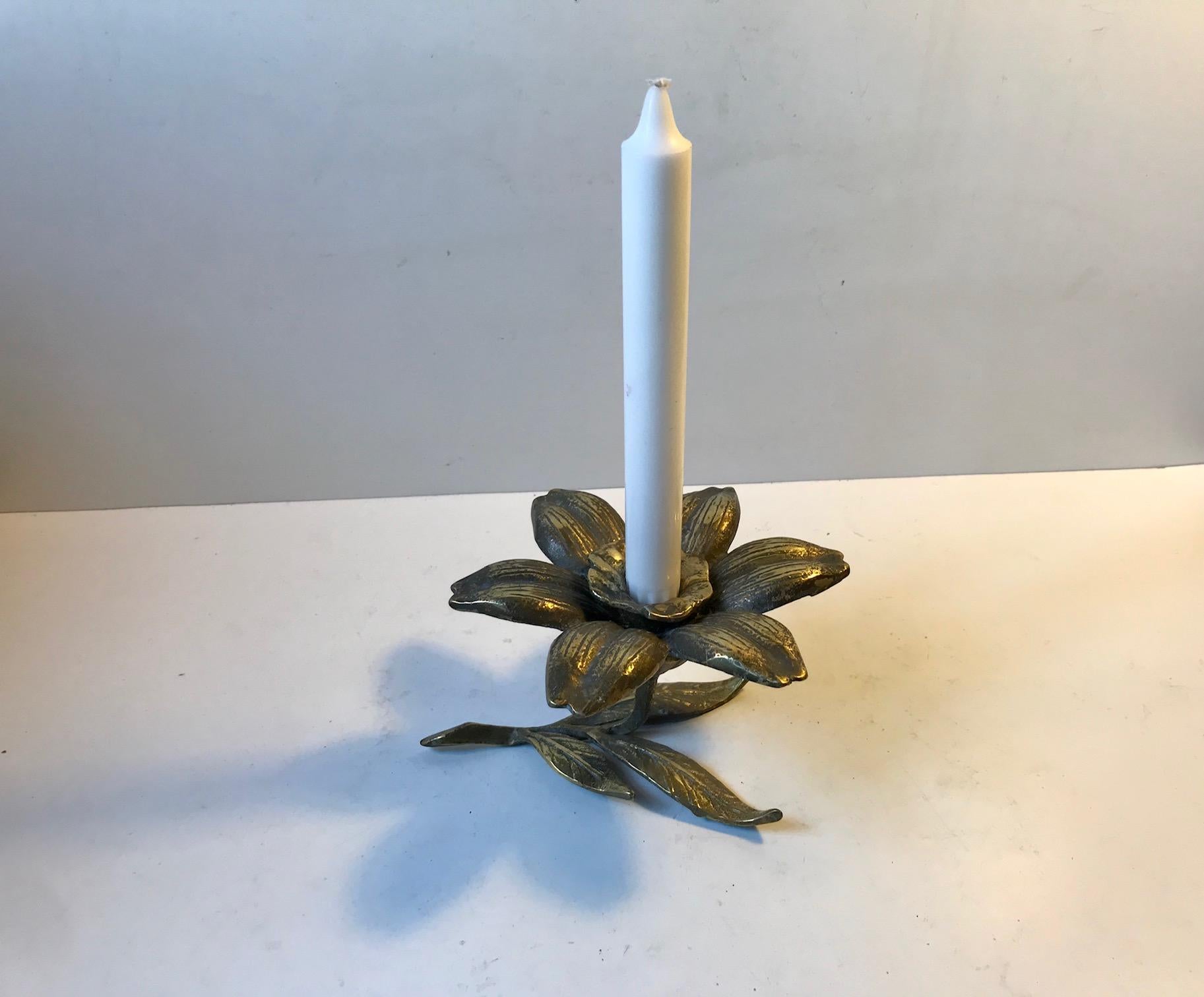 Naturalistically cast brass flower and leaf candlestick - Chamberstick for a regular sized candle. Manufactured in Germany or France during the 1930s. It shows a patina that is consistent with its age.