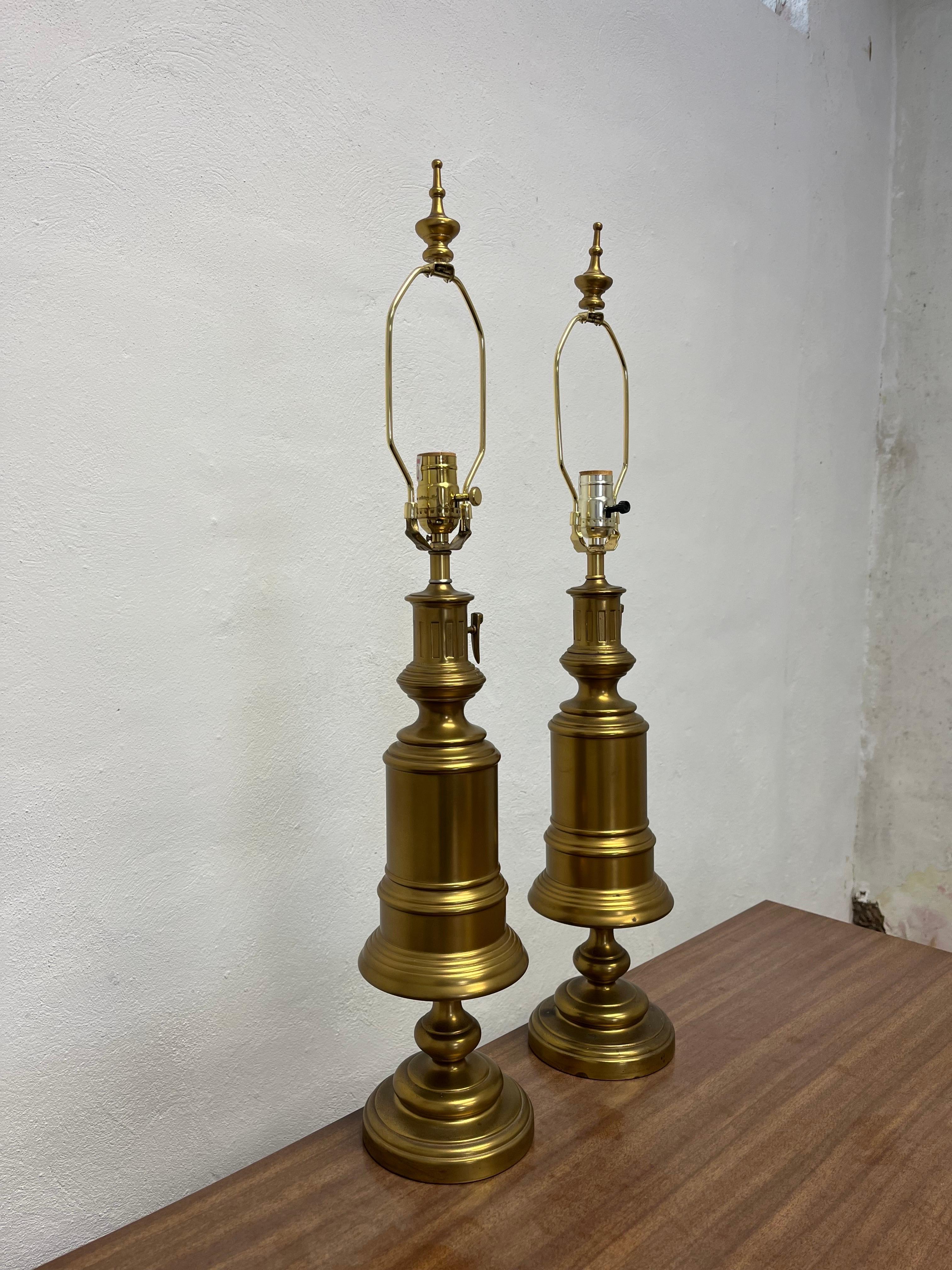 Beautiful classic brass lamps in the design of oil or gas lamps. Solid and heavy with wonderful finials. Classic lines which allow for the perfect addition to varied decor.