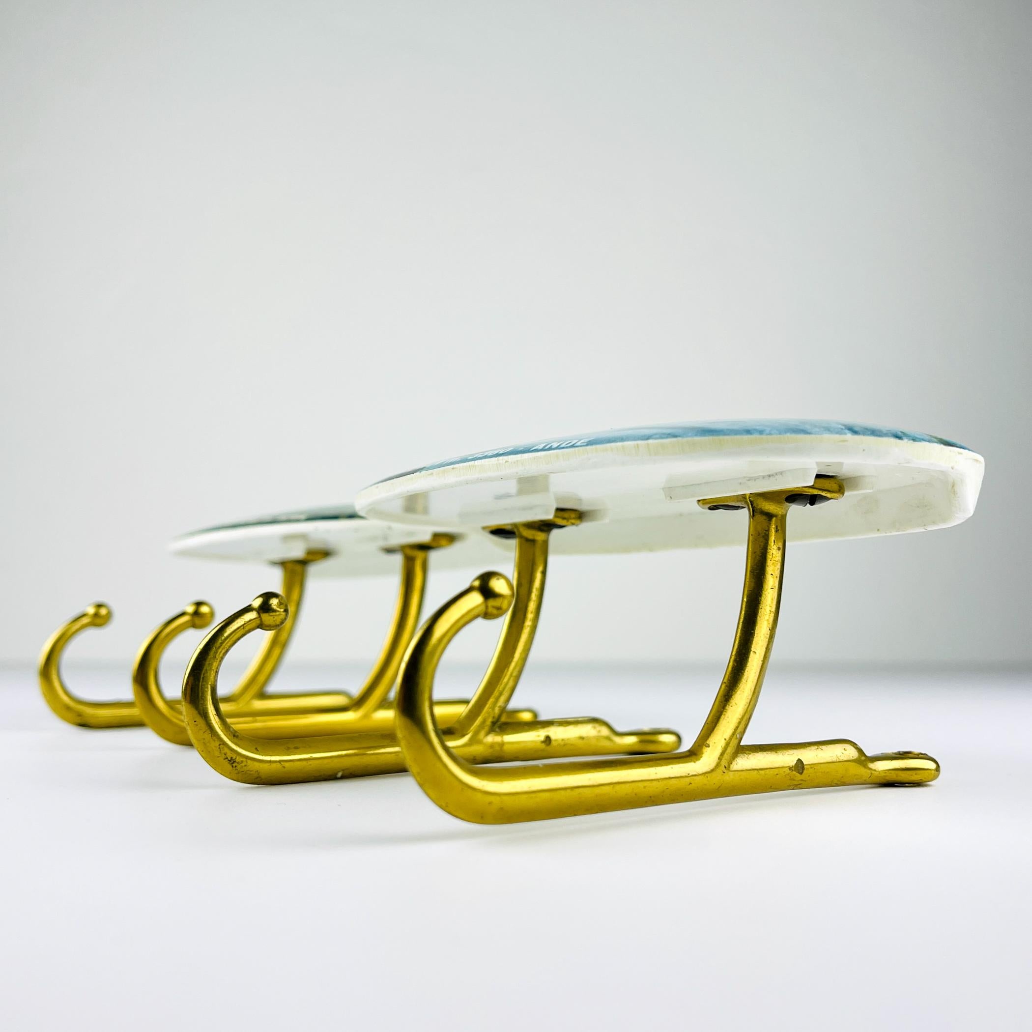 Beautiful set of 2 vintage brass wall hangers made in Italy in the 1950s.
The price for set!
Very good vintage condition.

Dimensions:
Width: 14 cm / 5.5 inches
Height: 12 cm / 4.7 inches
Depth: 7 cm / 2.75 inches

We offer a secure worldwide