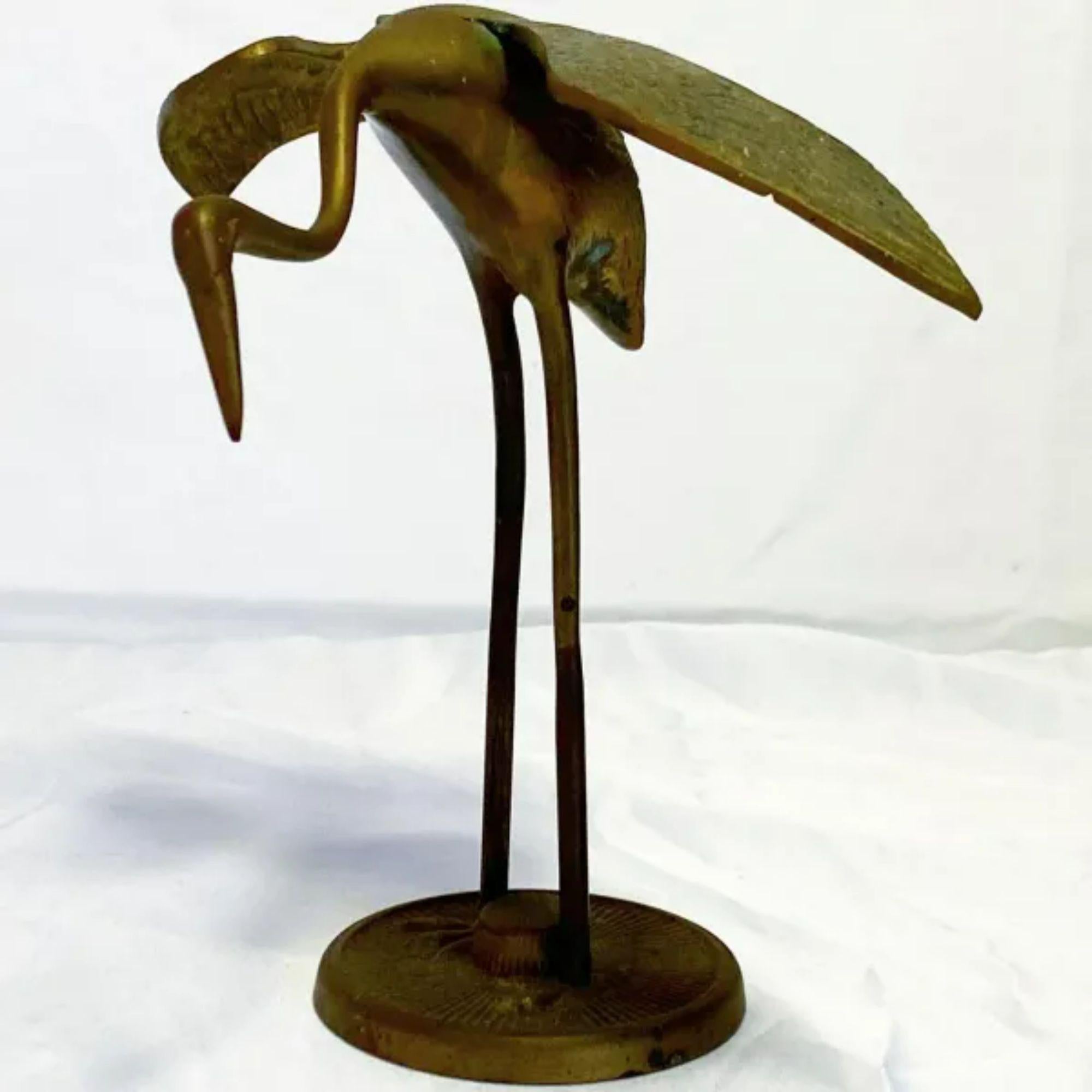 This is a beautiful brass sculpture depicting a heron scoping the ground for food.

Additional information: 
Material: Brass
Color: Brass
Style: Mid-Century, Mid-Century Modern, Vintage
Time Period: 1960s
Dimension: 8” L x 6” D x 7.5” H.