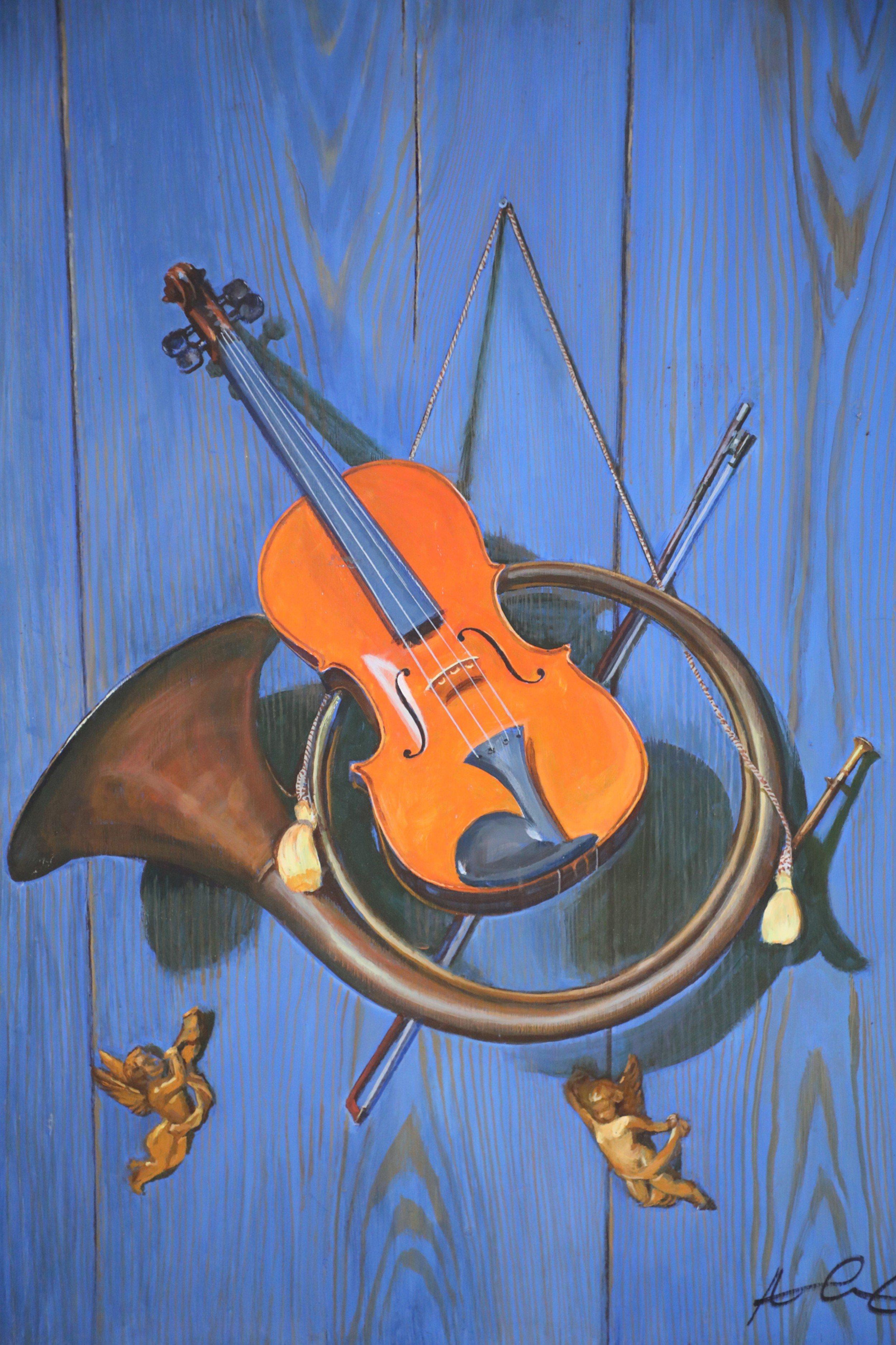 Vintage (20th century) acrylic still life of a brass horn and violin hanging on a blue woodgrain wall with tassels and two golden cherubs, painted on rectangular plywood.
       