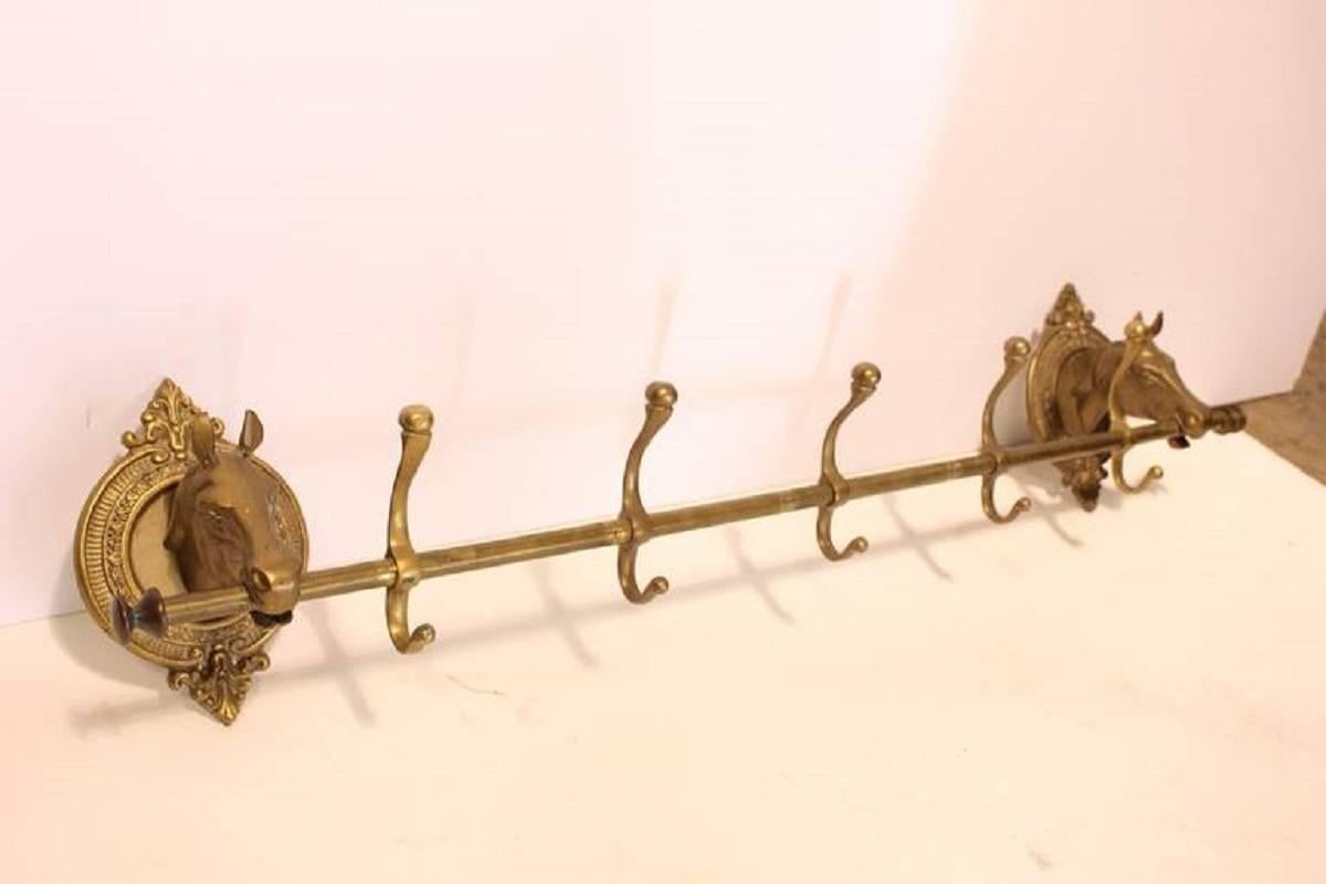 Vintage brass horse head coat rack.