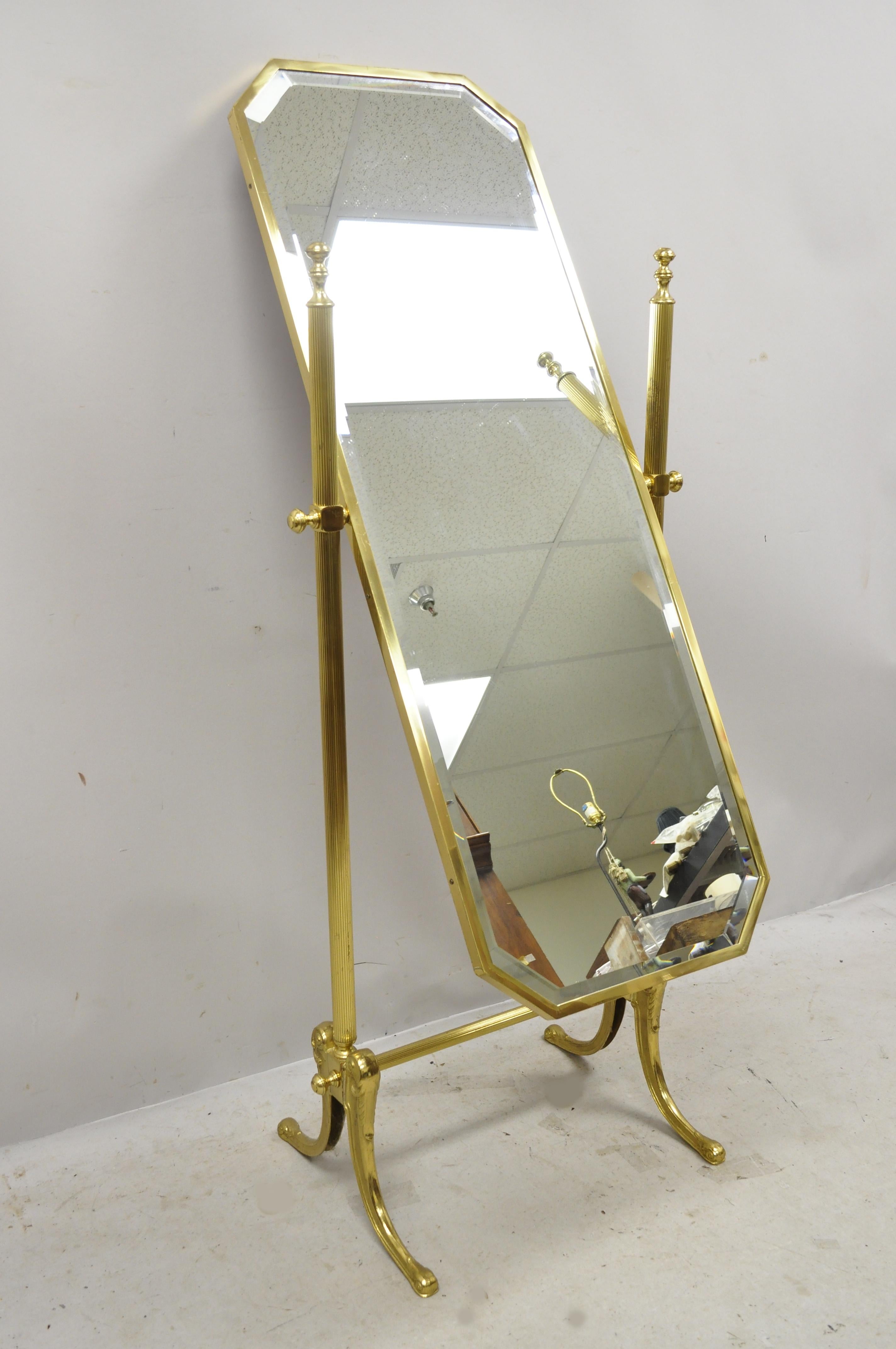 Vintage brass Italian neoclassical cheval standing dressing floor beveled mirror. Item features a beveled glass mirror, brass construction, tapered legs, very nice vintage item, great style and form, circa mid-20th century. Measurements: 61.5