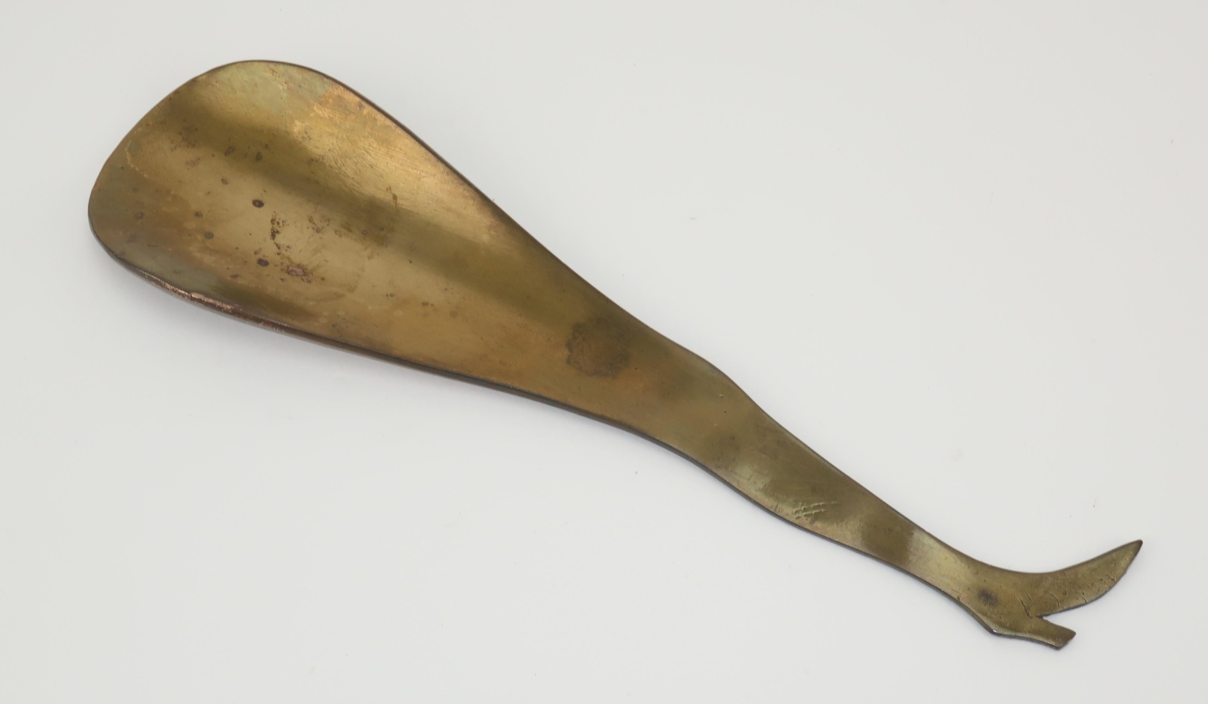 Get a leg up and put your best foot forward with a 1950's era brass shoe horn cleverly shaped like a ladies' leg. Metal shoe horns are the best and this one is adorable to boot ... no pun intended. No maker's mark.
CONDITION
Good vintage condition