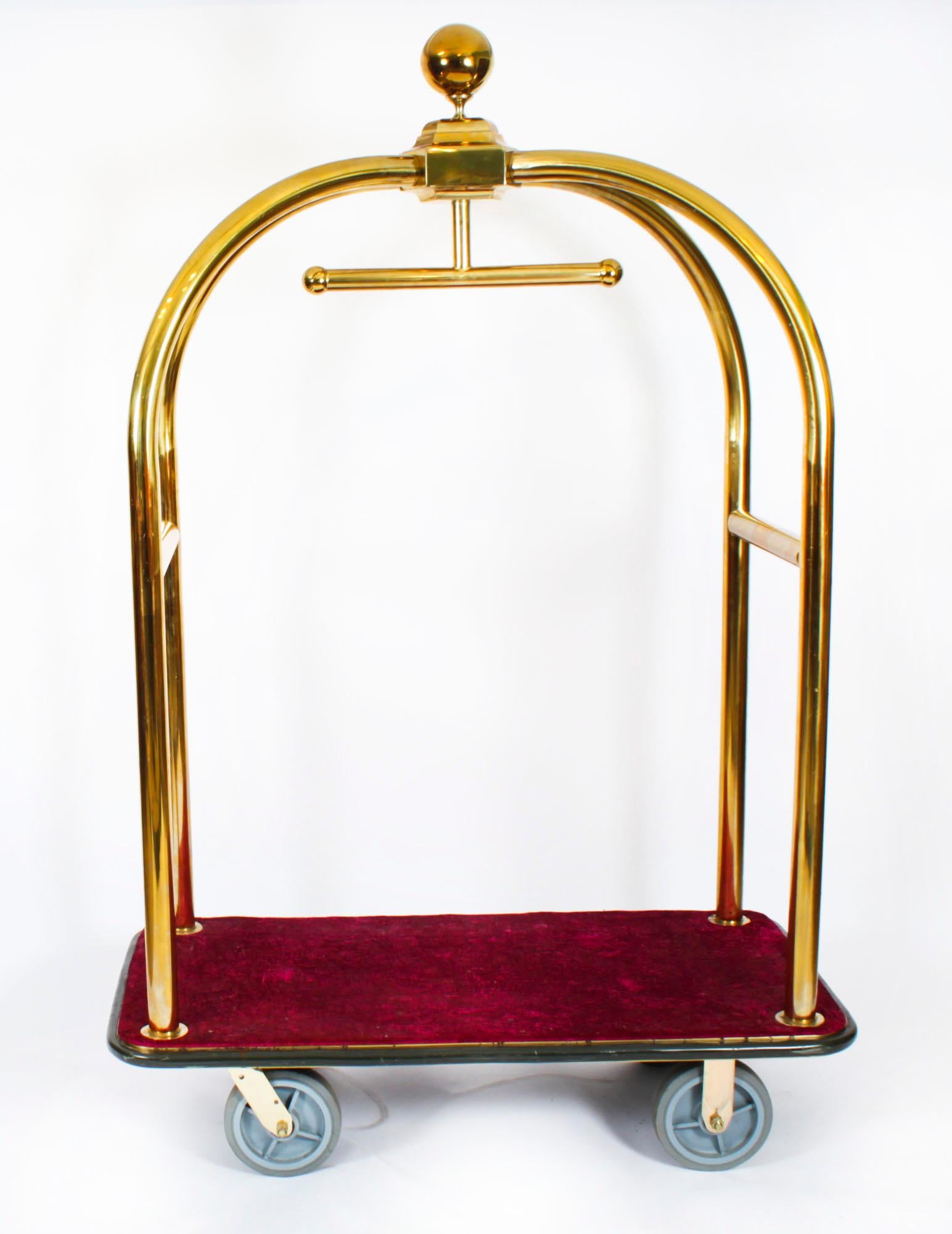 A Vintage brass luxury hotel valet trolley with velvet covered base, ornately decorated with a brass sphere, dating from the late 20th Century.

Condition:
In excellent condition, please see photos for confirmation.

Dimensions in cm:
Height 191 cm