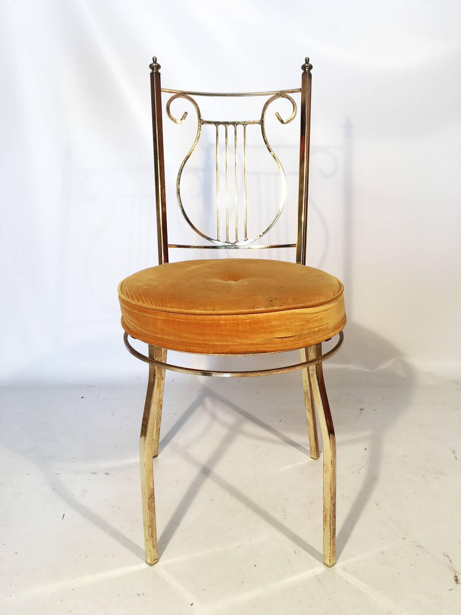 Brass lyre back vanity chair by George Koch Sons, circa 1960s. Structurally sound and minor age appropriate wear. Velvet seat cushion with minor marks. Measure: Seat height is 17.5