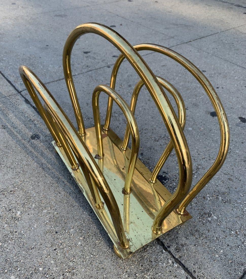 Vintage brass magazine rack in the style of Dorothy Thorpe. The piece is in good vintage condition, with some tarnishing in some areas.
Measurements:
12.75 inches high x 15.25 inches wide x 9.50 inches deep.