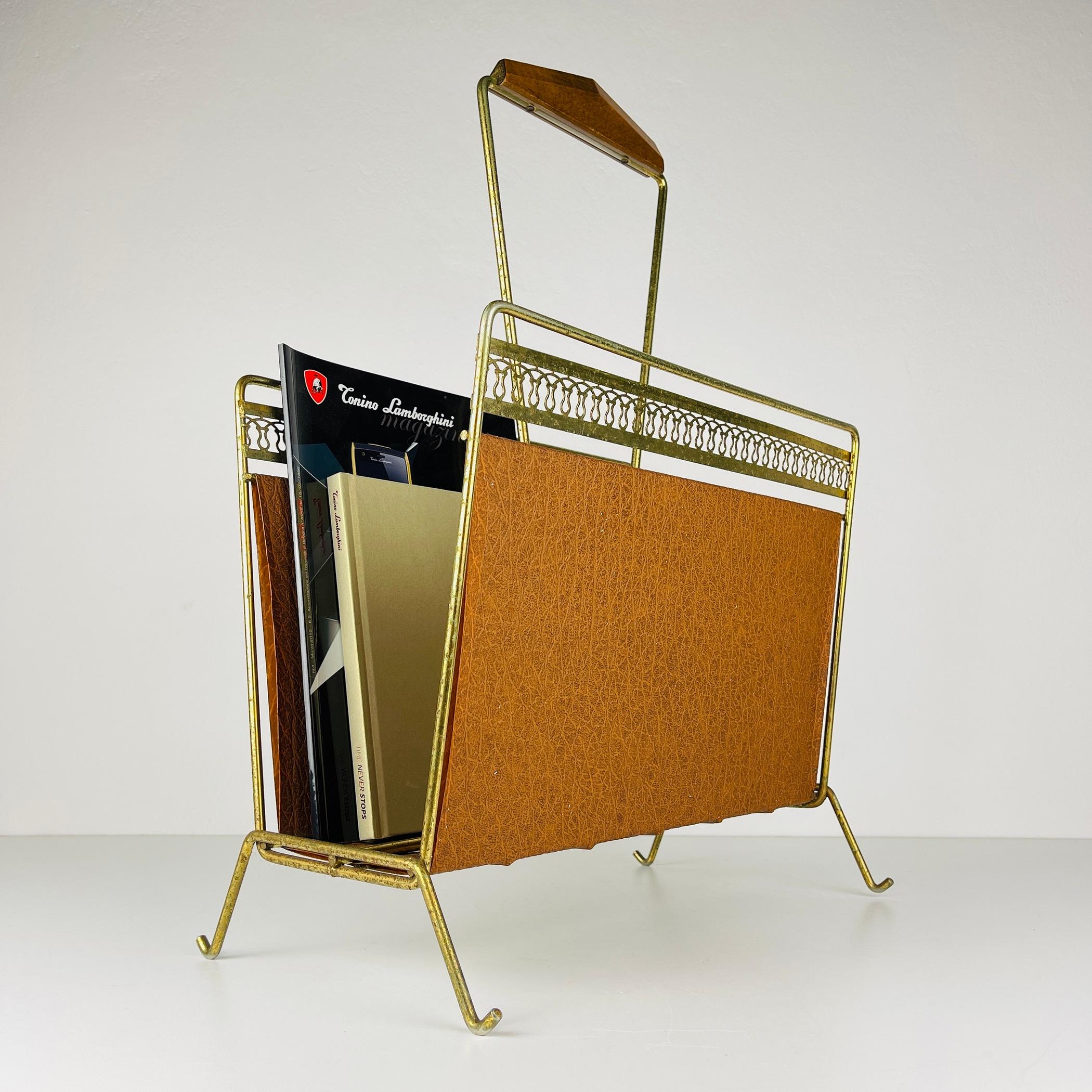 A midcentury magazine rack for magazines and newspapers. Made of brass and leatherette in Italy in the 1960s. All parts are original. Wonderful natural patina. A charming piece from the middle of the last century will certainly decorate your