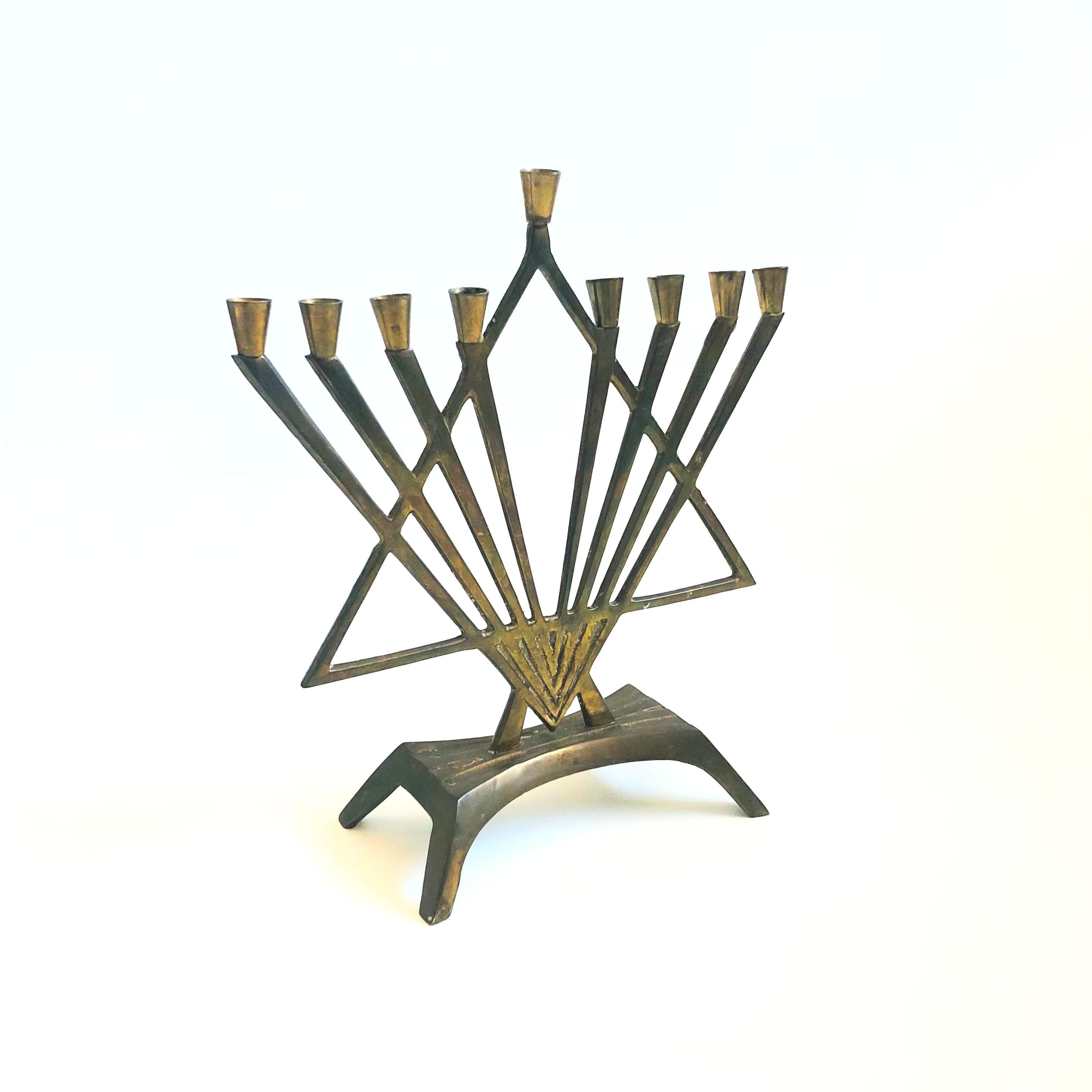 A vintage brass menorah in a lovely star shape.

