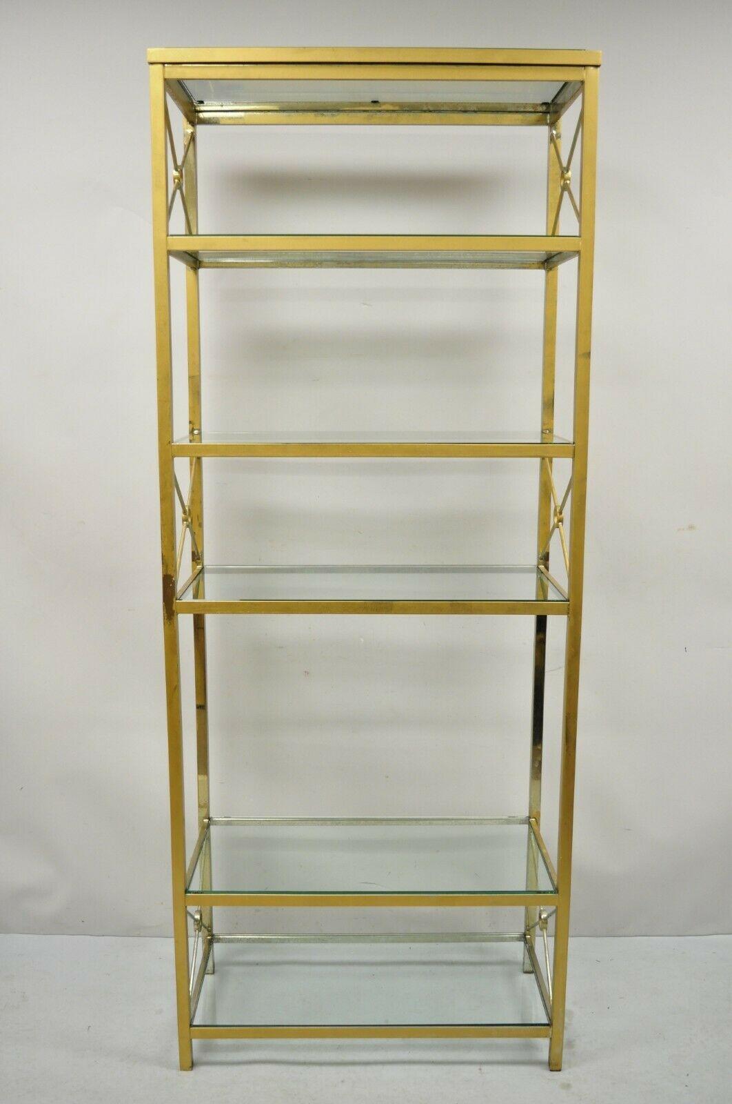 Vintage Brass Metal Gold X-Form Tall Hollywood Regency Modern Curio shelf bookcase. Item features a brass plated metal frame, x-form design, 6 glass shelves, very nice vintage item, clean modernist lines, quality craftsmanship, great style and form.
