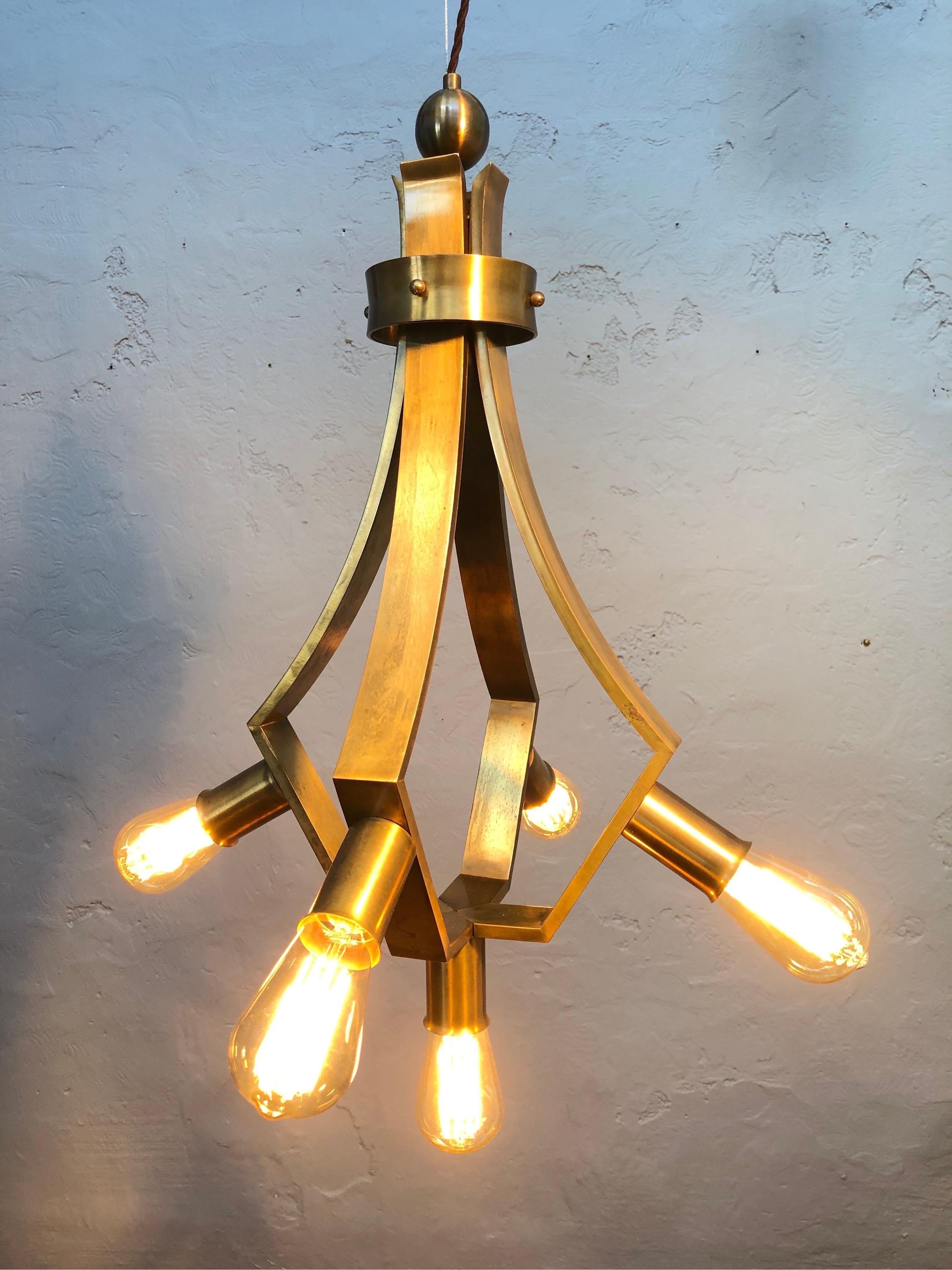 Vintage mid century brutalist 5 lamp chandelier. 
Great design. 
Great quality. 
In great vintage condition. 
Rewired and grounded with a twisted brown cloth flex. 
Also a new wire for hanging has been fitted and attached. 
Lightly cleaned and with