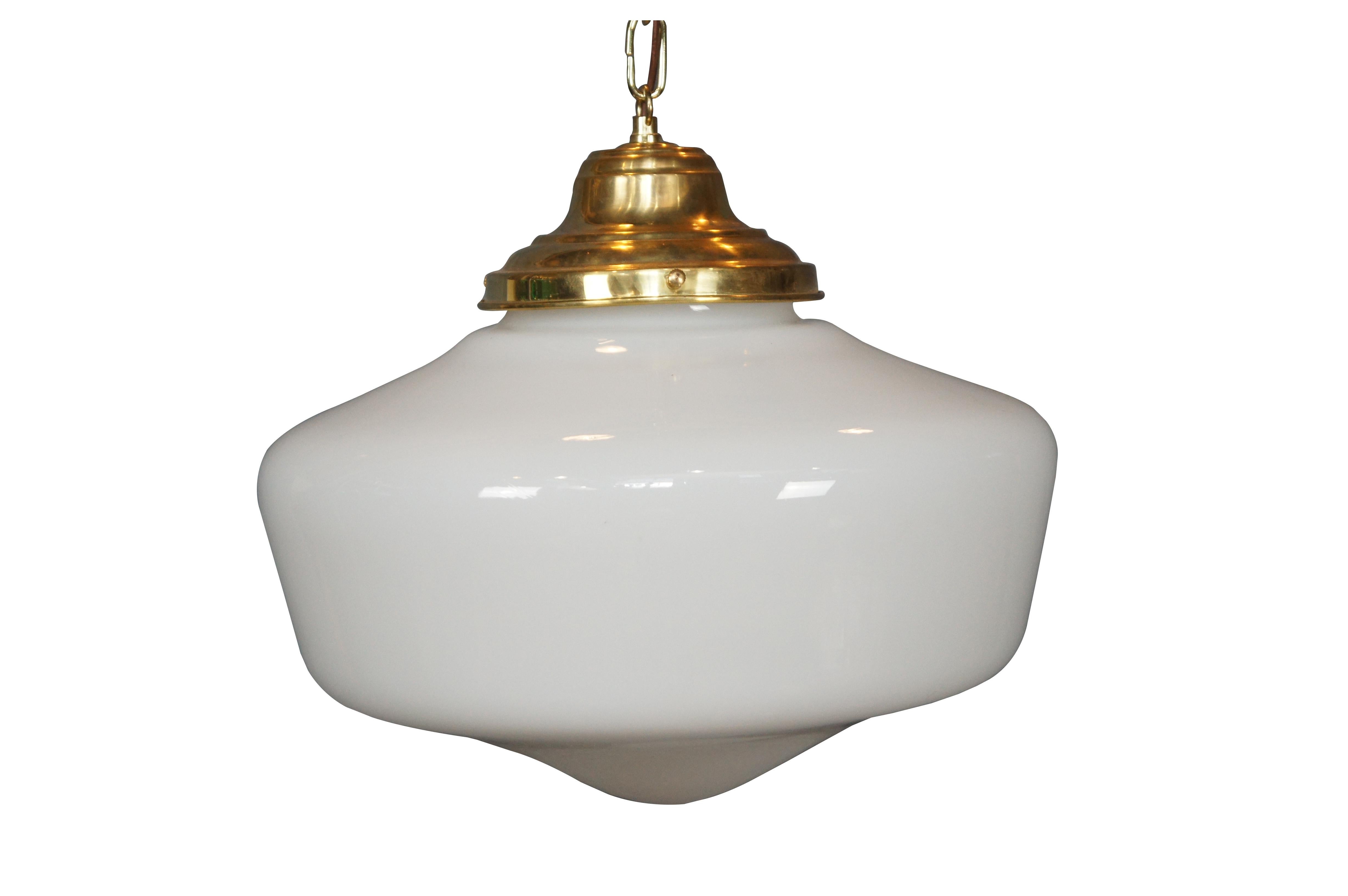  vintage art deco style schoolhouse pendant light with brass caps and milk glass globe. Wired with plug.

Dimensions:
15