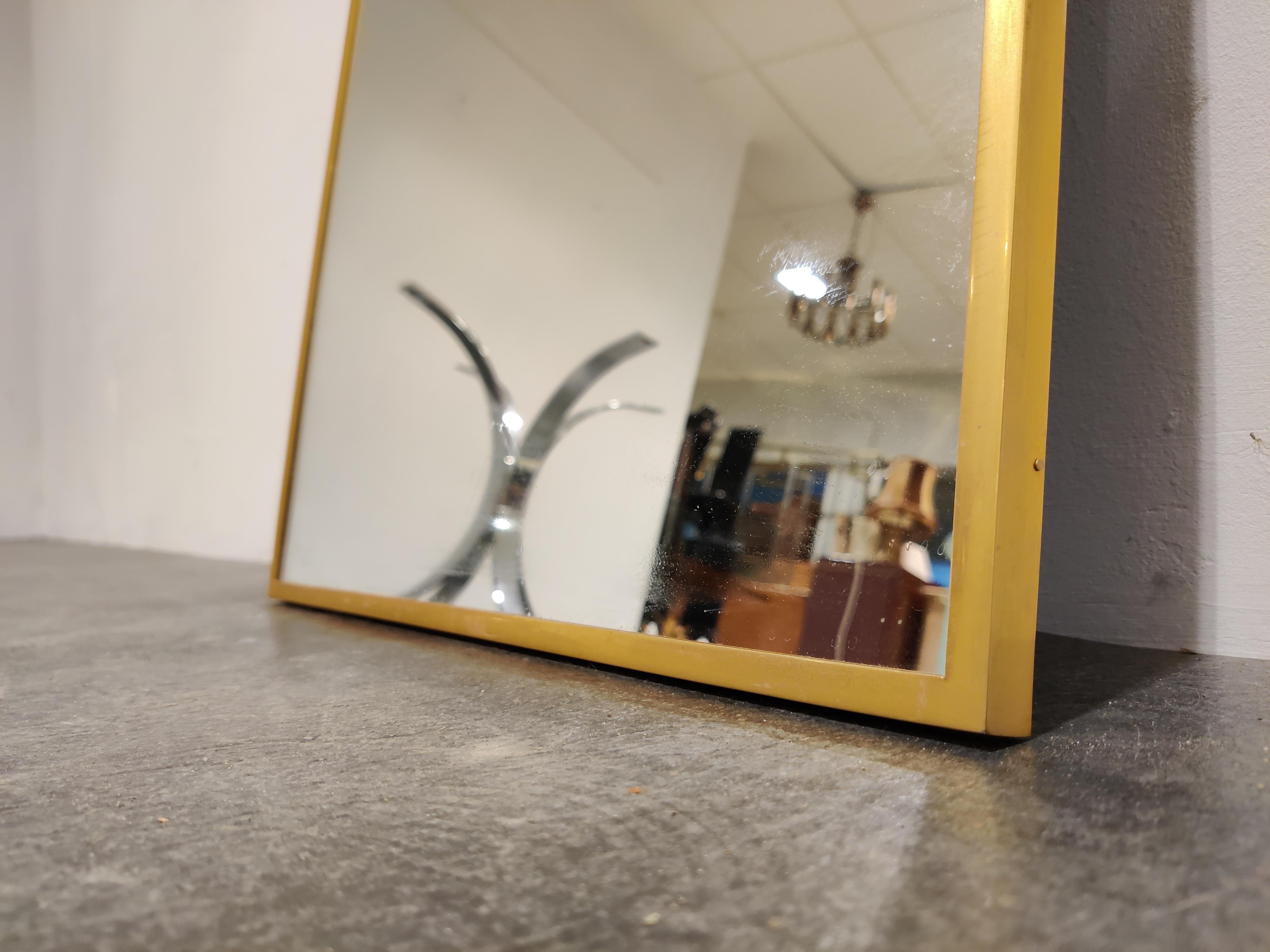 Elegant brass framed mirror from the 1970s.

1970s - Belgium

Dimensions:

Height: 71cm
Width: 47cm

Ref.: 90124
      