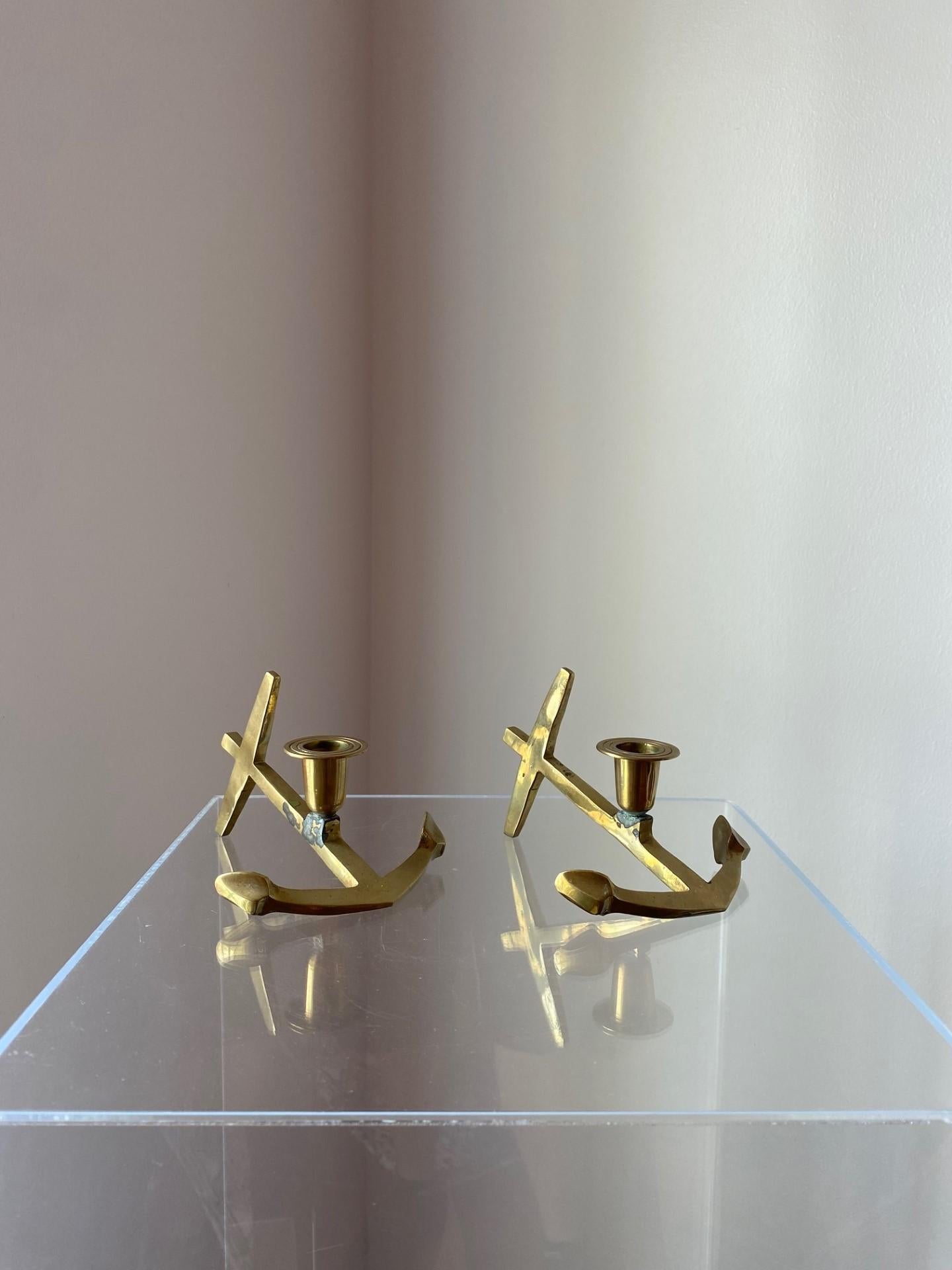 Beautifully forged in solid brass, these nautical anchors have a classic aesthetic that is ideal for coastal and nautical décor but can easily translate to industrial and eclectic styles. Stylish and with beautiful patina. An incredible addition to