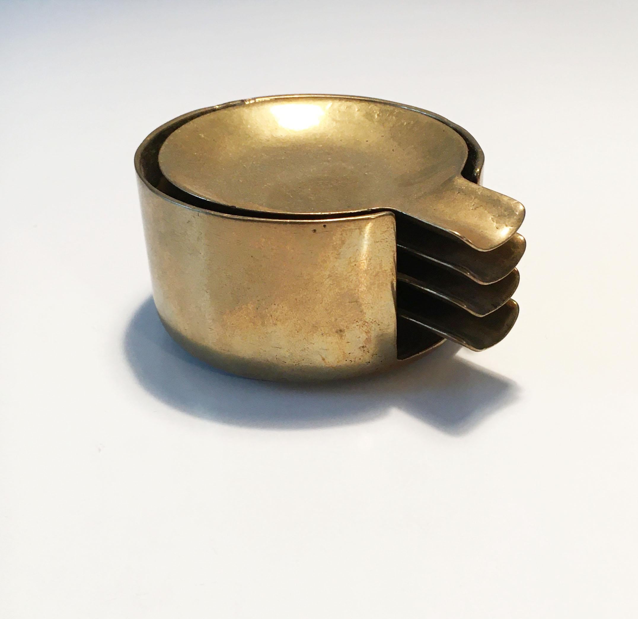 Vintage brass nesting ashtrays set of four, Austria, 1950s.