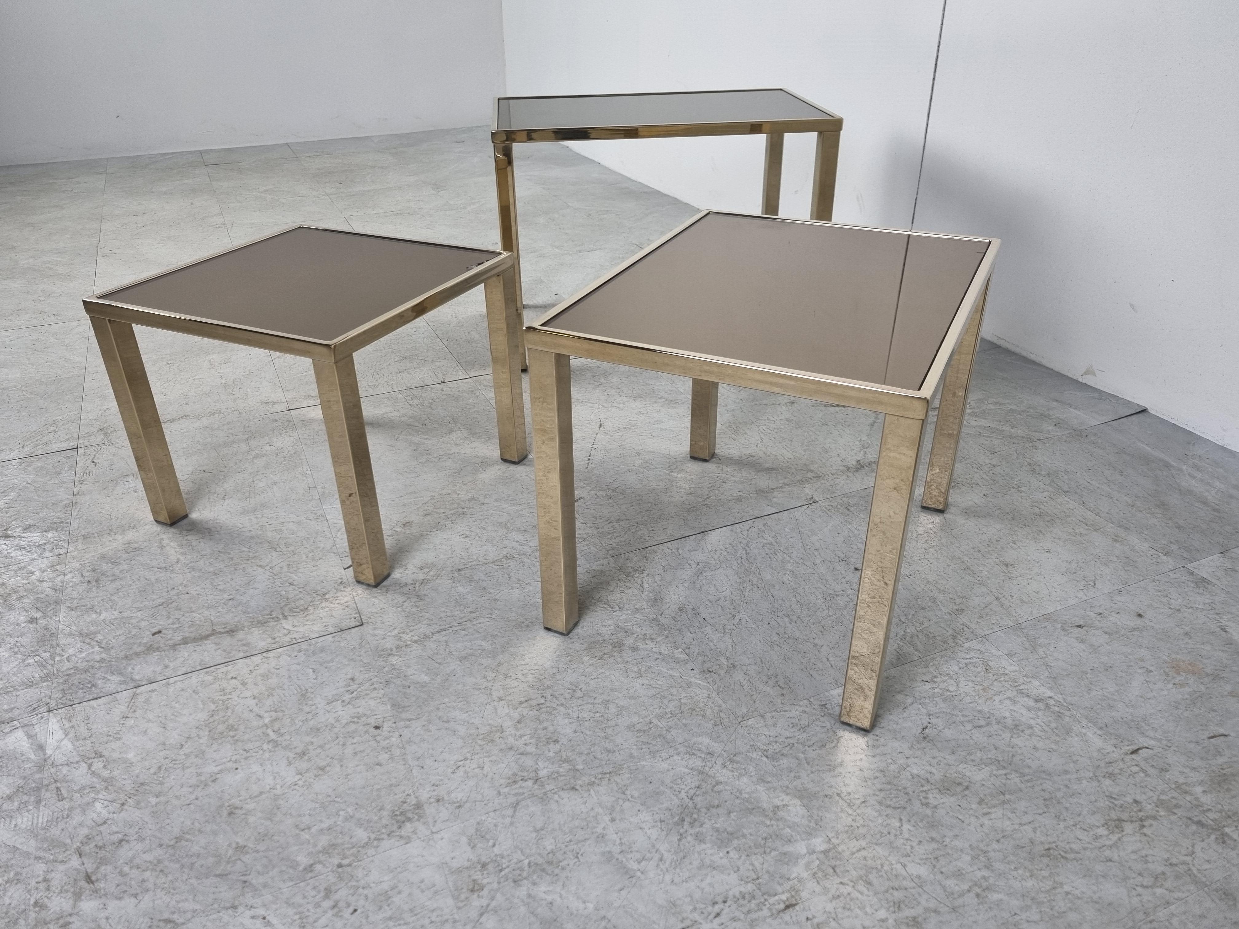 Set of thee brass nesting tables with original mirrored glass tops.

Nice and shiny brass.

1970s - Belgium

Dimension highest table:
Height: 40cm/15.74