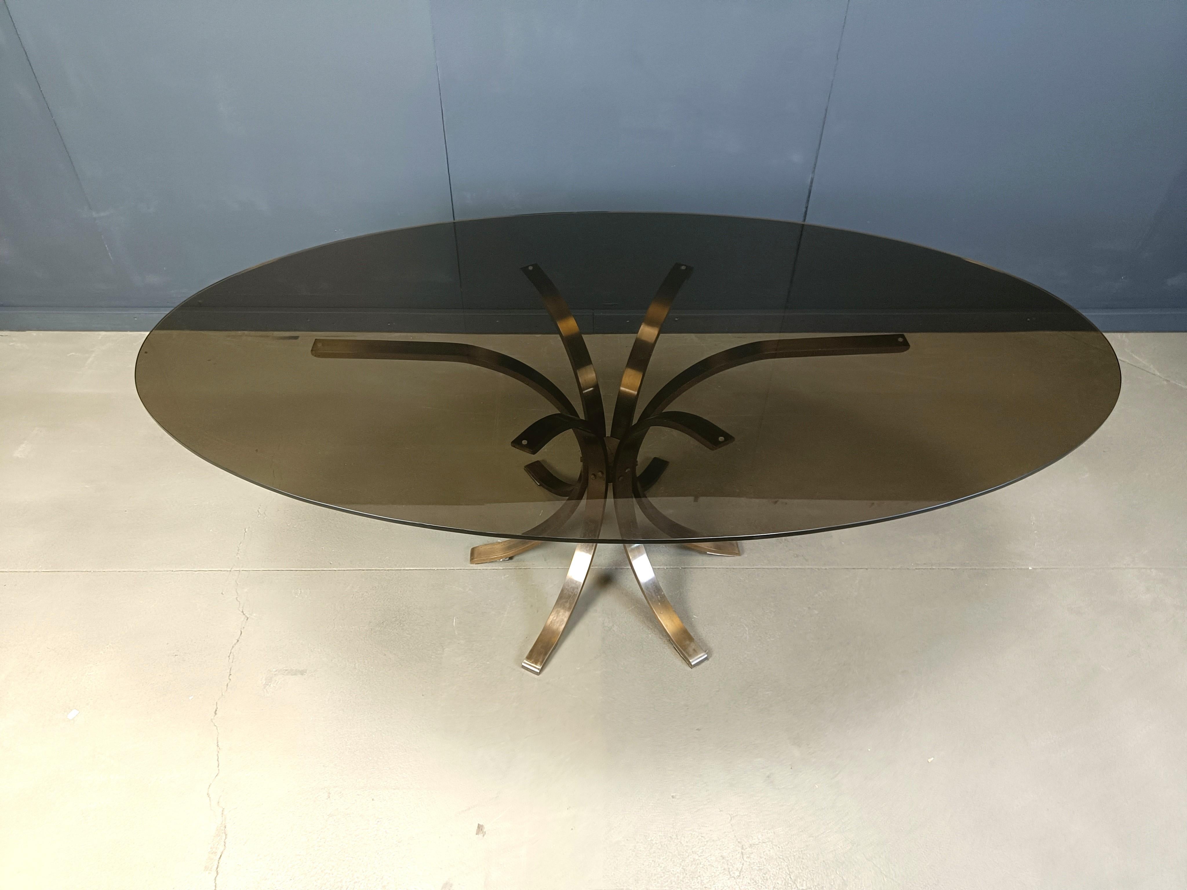 Gorgeous solid brass dining table with a large smoked glass oval top.

Timeless design, with a touch of seventies.

1970s - France

Good condition

Height: 75cm
Width: 220cm
Depth: 125cm

Ref: 25041103

We can also ship the base alone saving you a