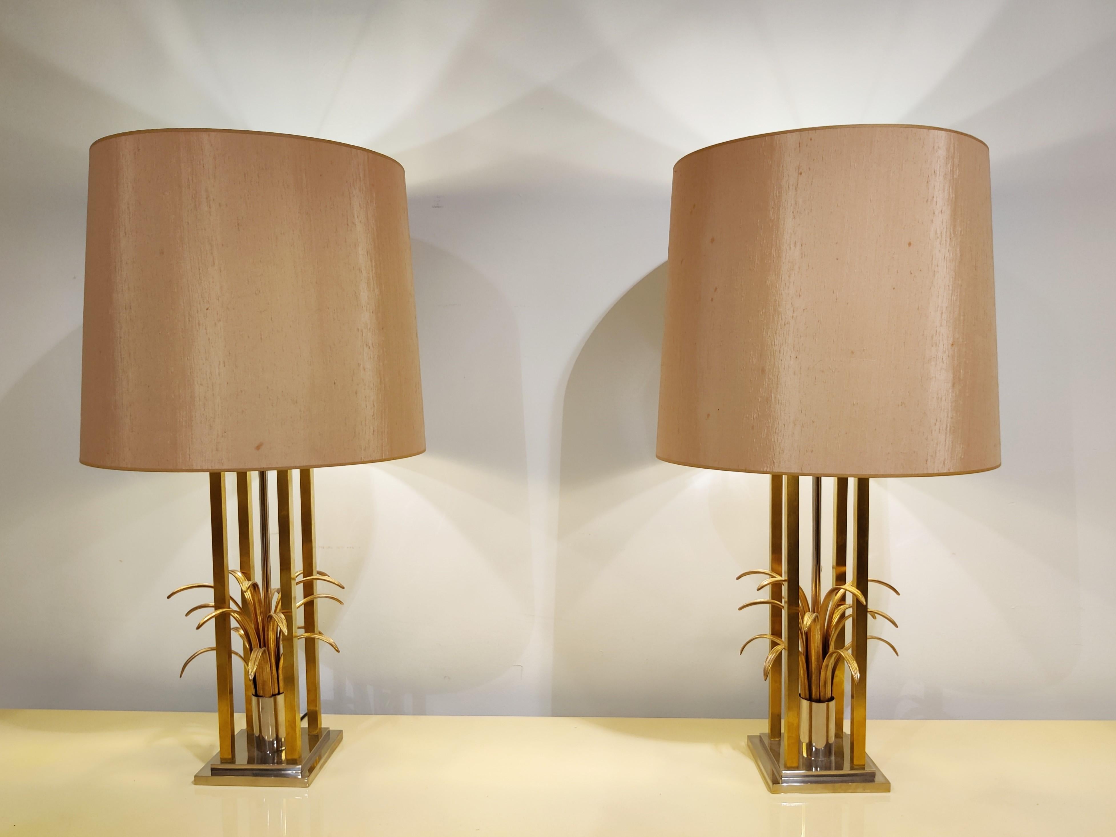 Pair of very stately, large pineapple leaf lamps. 

Rare models with highly detailed leafs and brass frames. Very good quality.

Comes with salmon/beige lampshades (original) which emit a warm dimmed light.

Great lamps to decorate a large