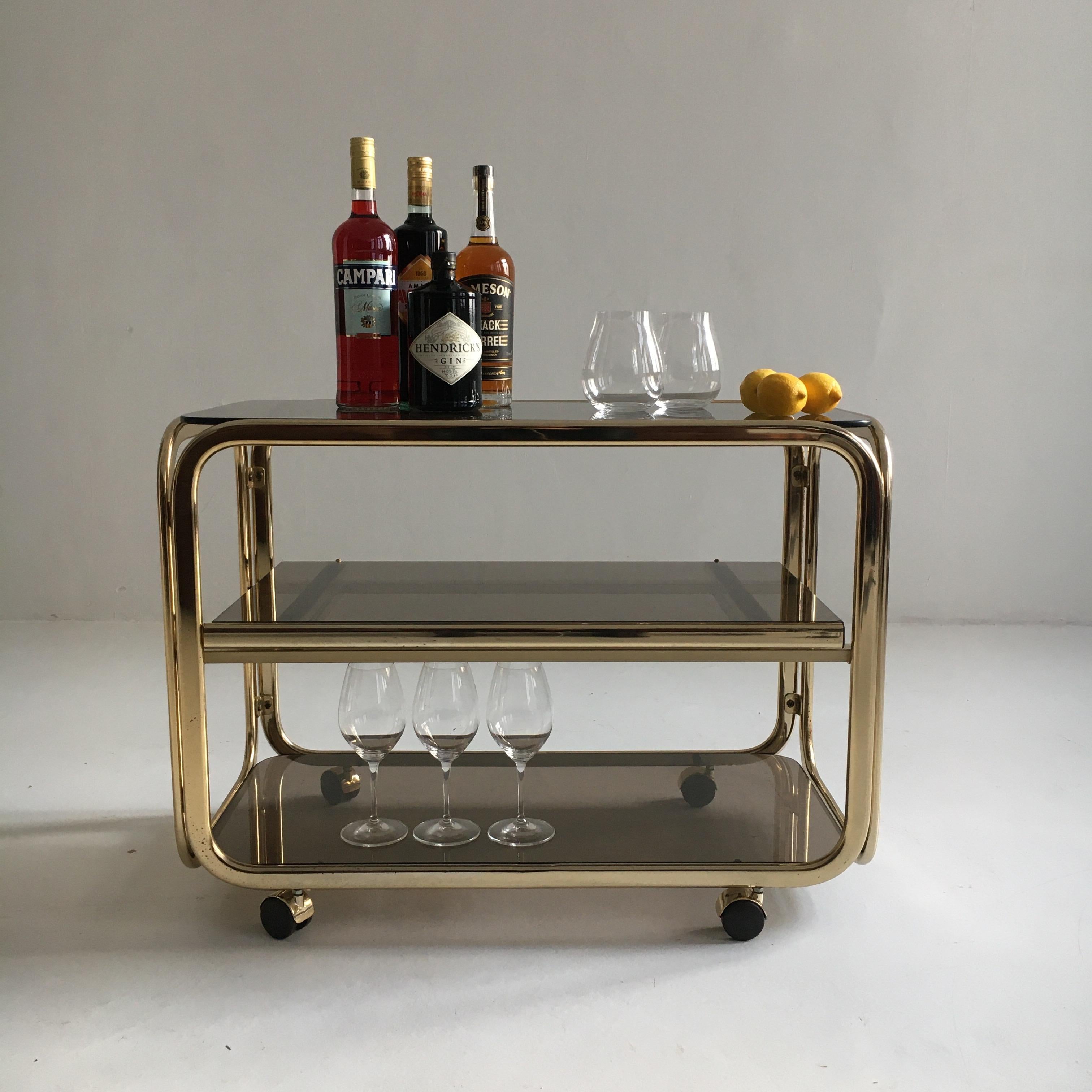 Vintage brass-plated bar cart table brown smoked glass plates by Morex, 1970s.