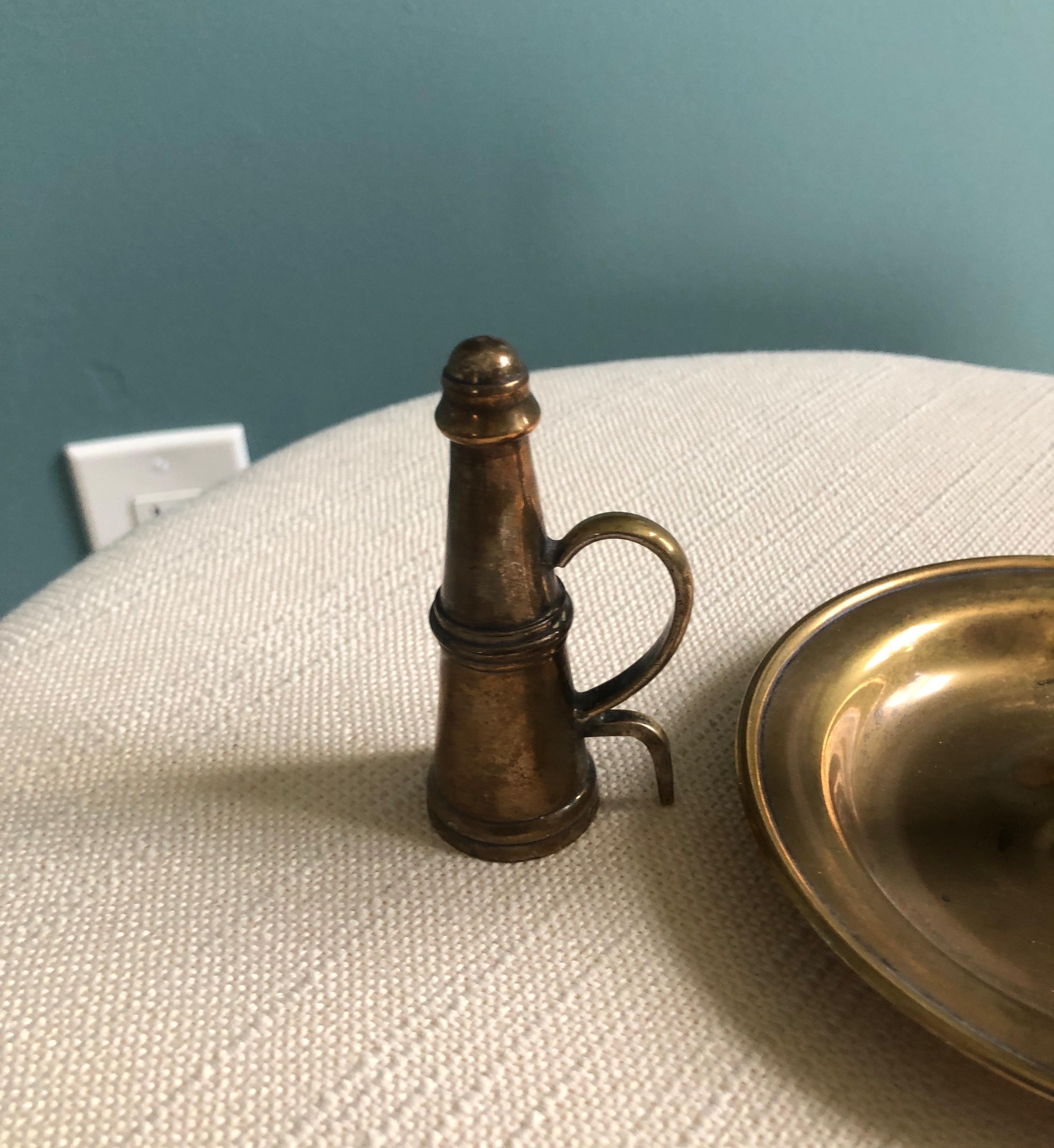 Vintage brass-plated round candleholder with snuffer.
Size: 5