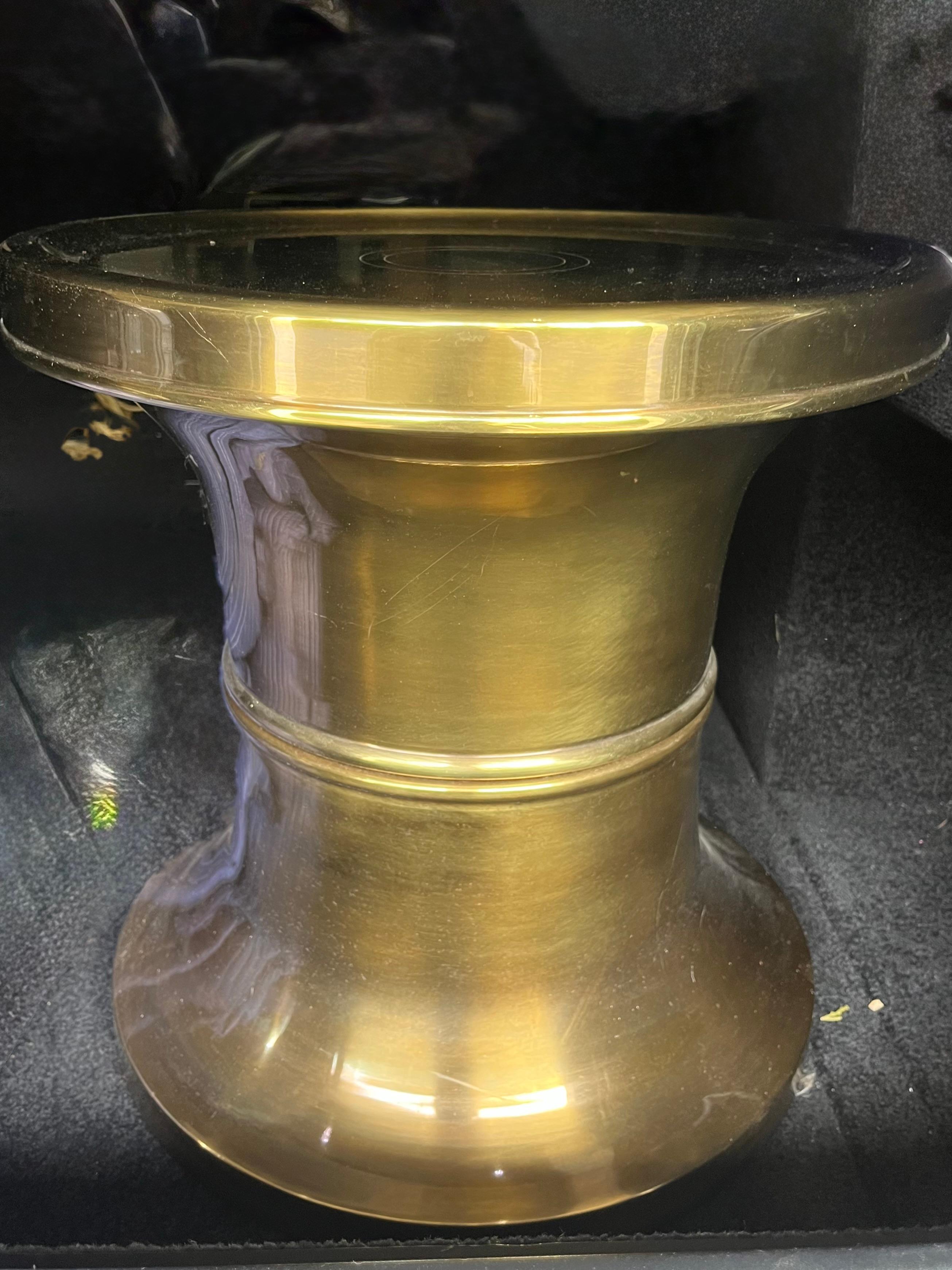A 1970s small polished brass round low table or stool  manufactured by Mastercraft. Perfect as an end table or pull up drinks table.
