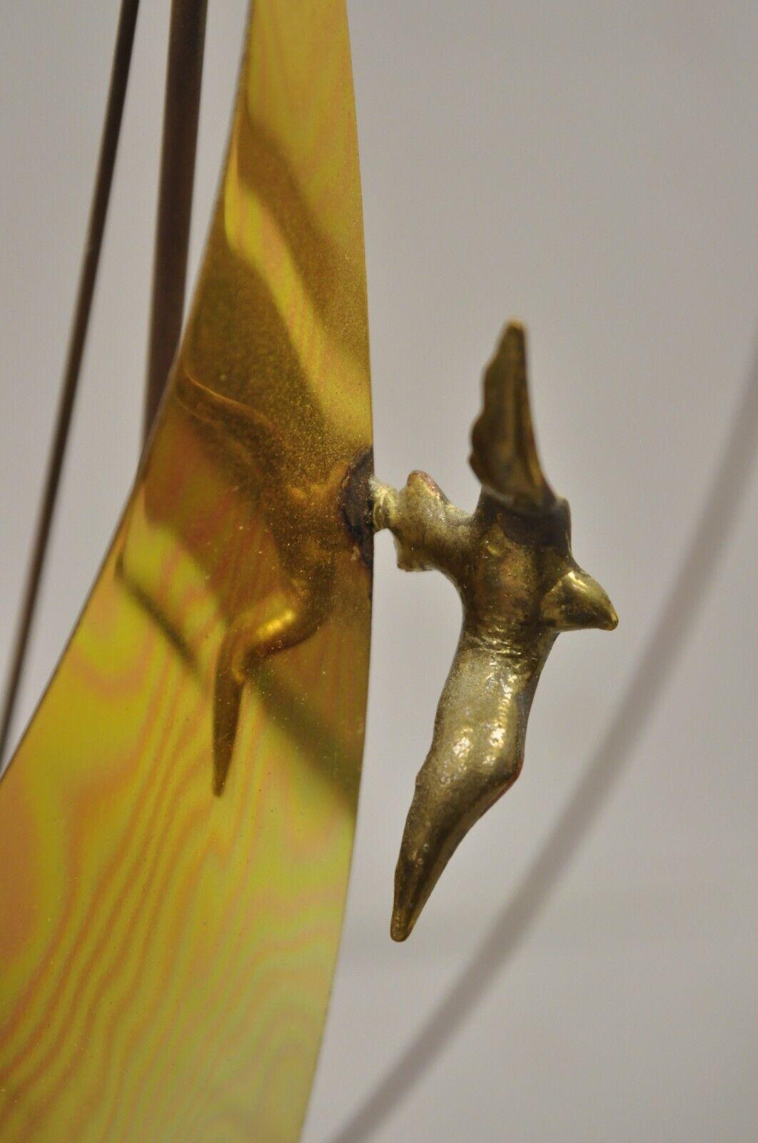 brass sailboat sculpture