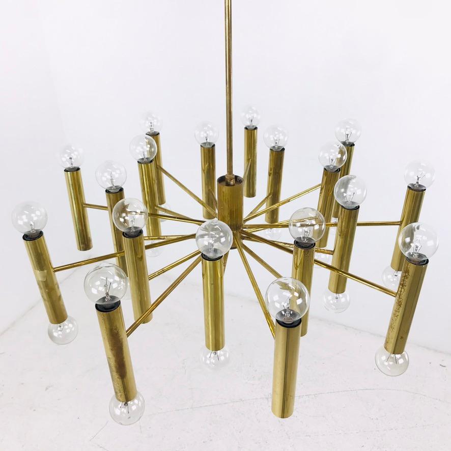 An extraordinary Sciolari chandelier made in Italy, circa 1970s. 18 arms with 36 opposing bulbs emerge from a brass body to create an elegant statement piece.